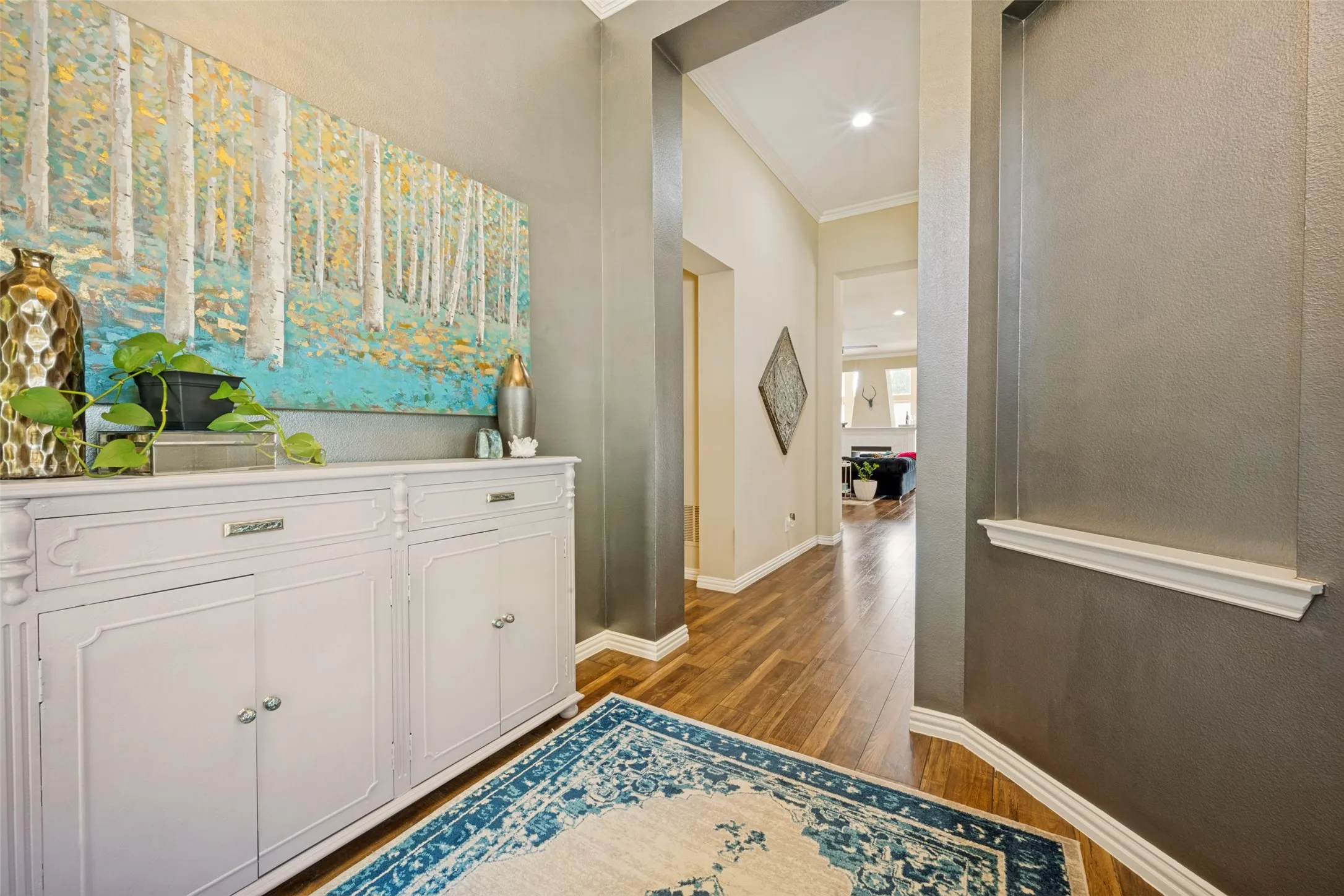 Welcoming entry with hardwoods and room for your art and entry table.