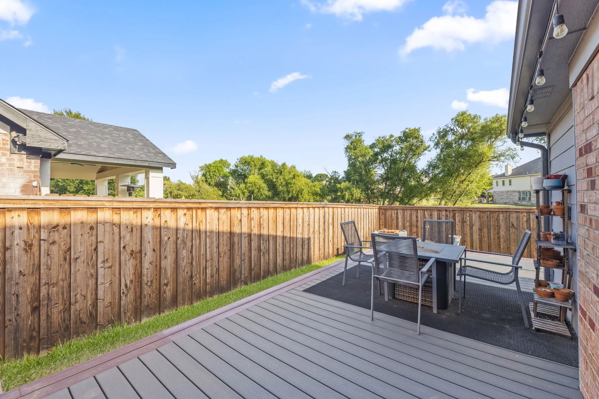 Expansive composite deck with modern gray finish, ideal for entertaining and outdoor dining