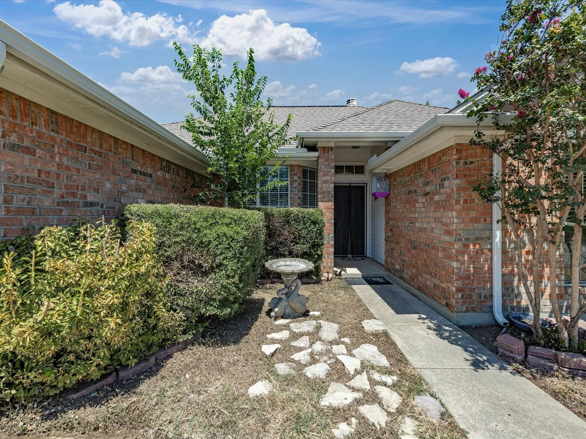 Brick exterior with a covered entry