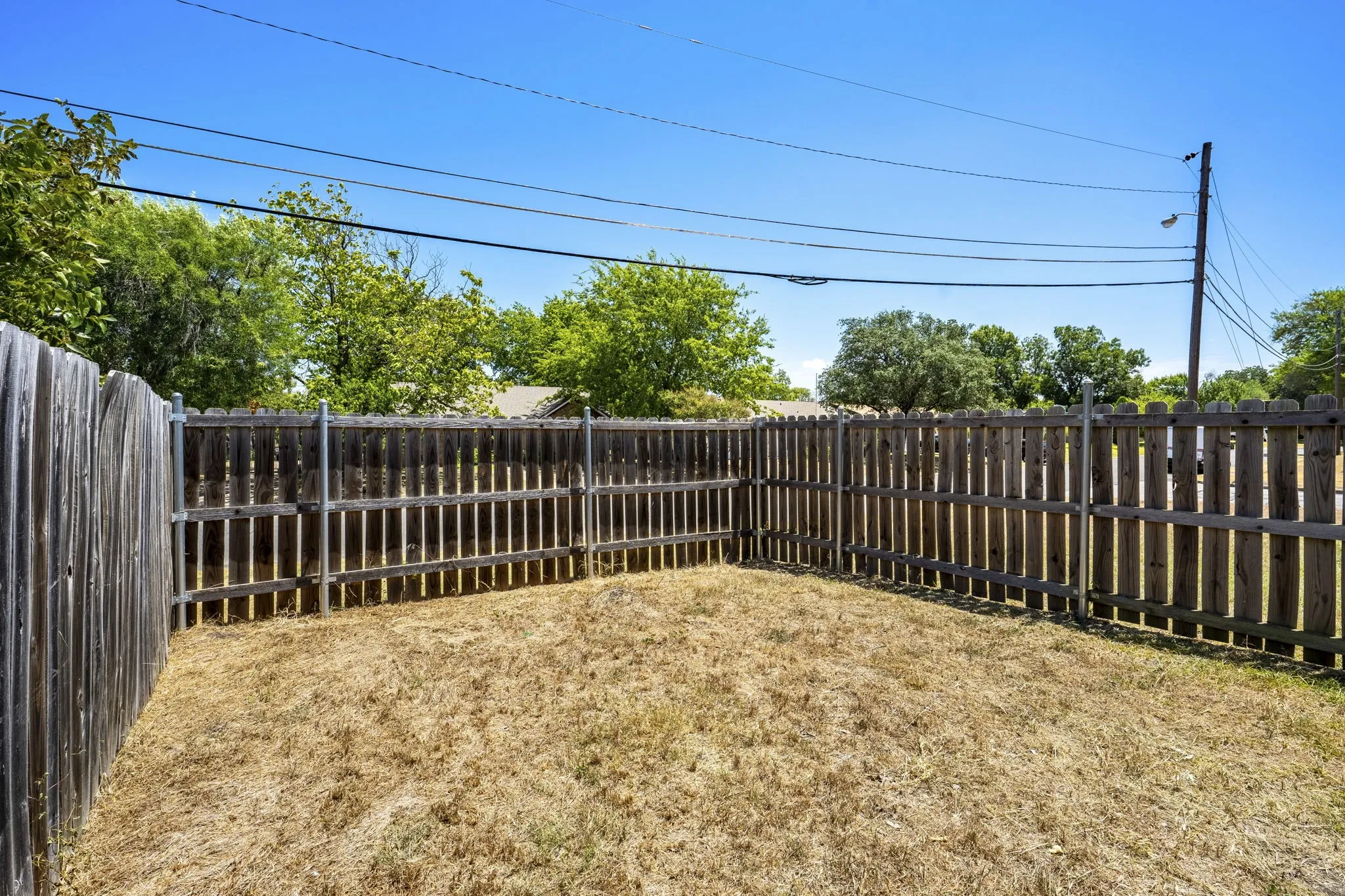 Fenced outdoor space with wood fencing