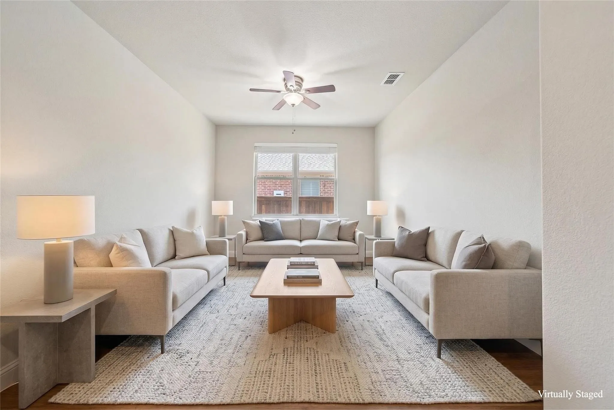 Recessed lighting, wood-finish flooring, and a ceiling fan with integrated lighting