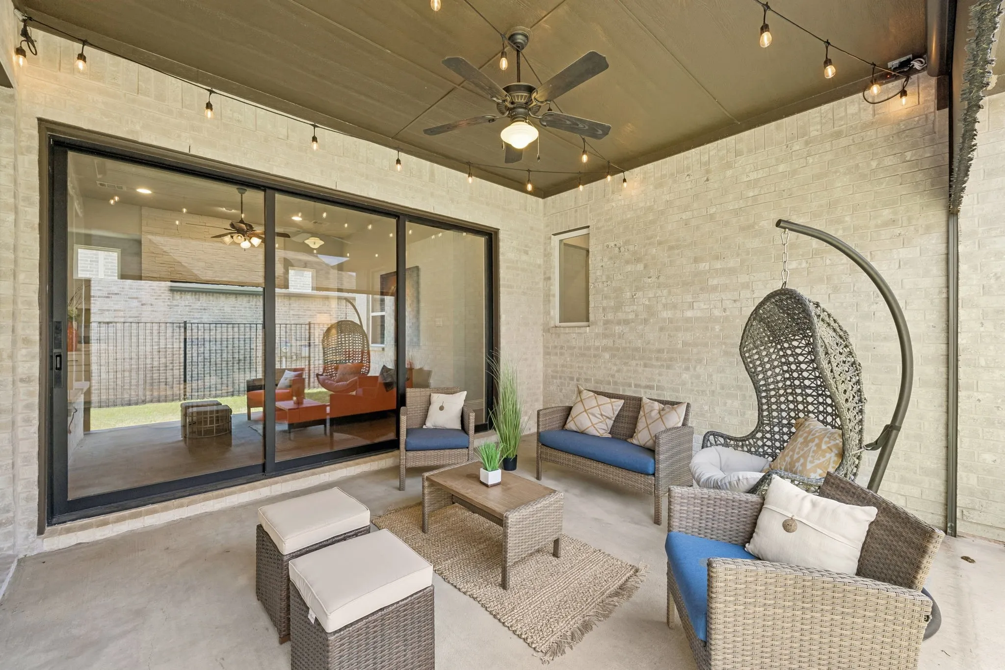 Covered patio with sliding doors and retractable screen