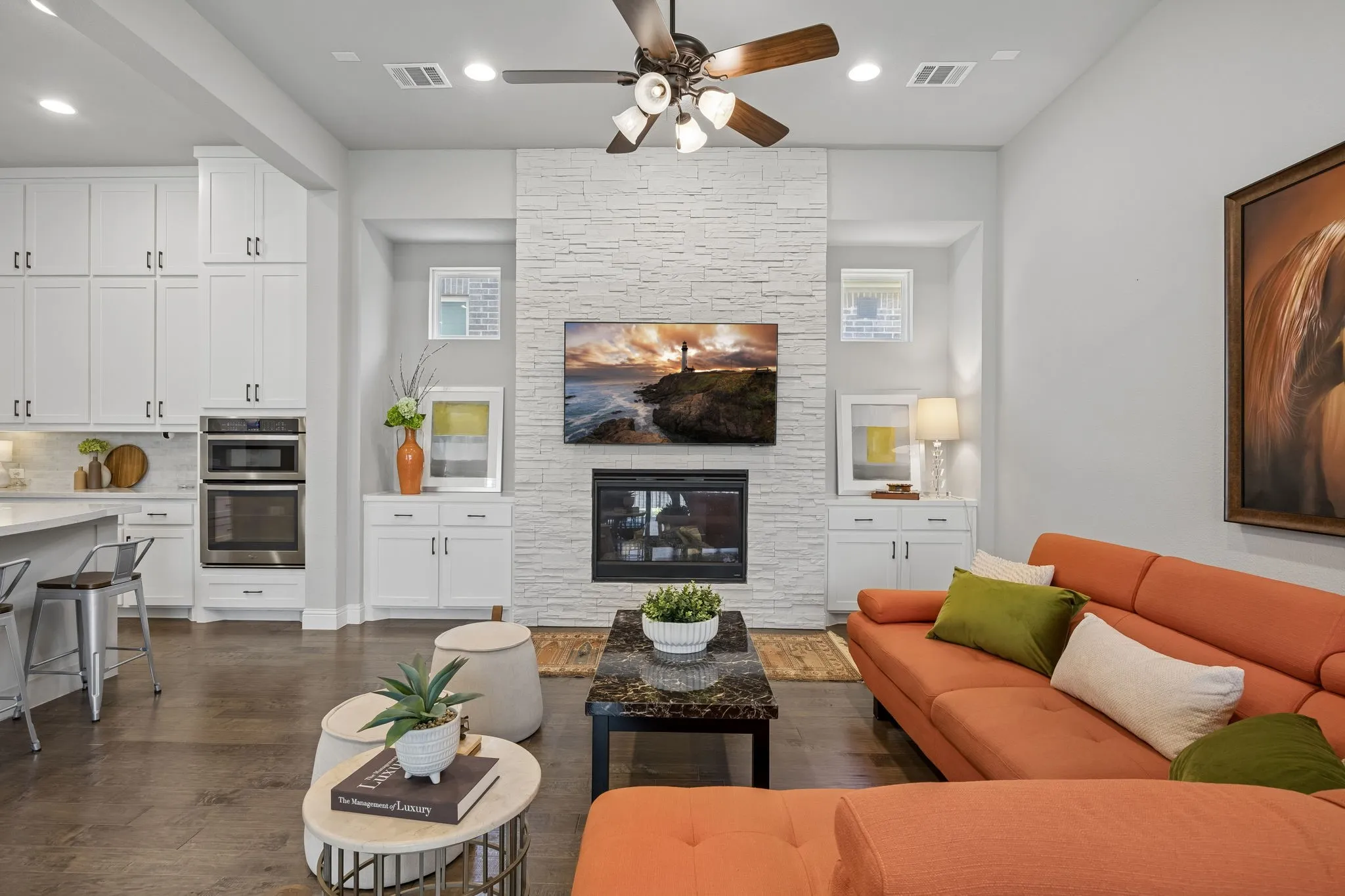 Large family room with fireplace and built in cabinets