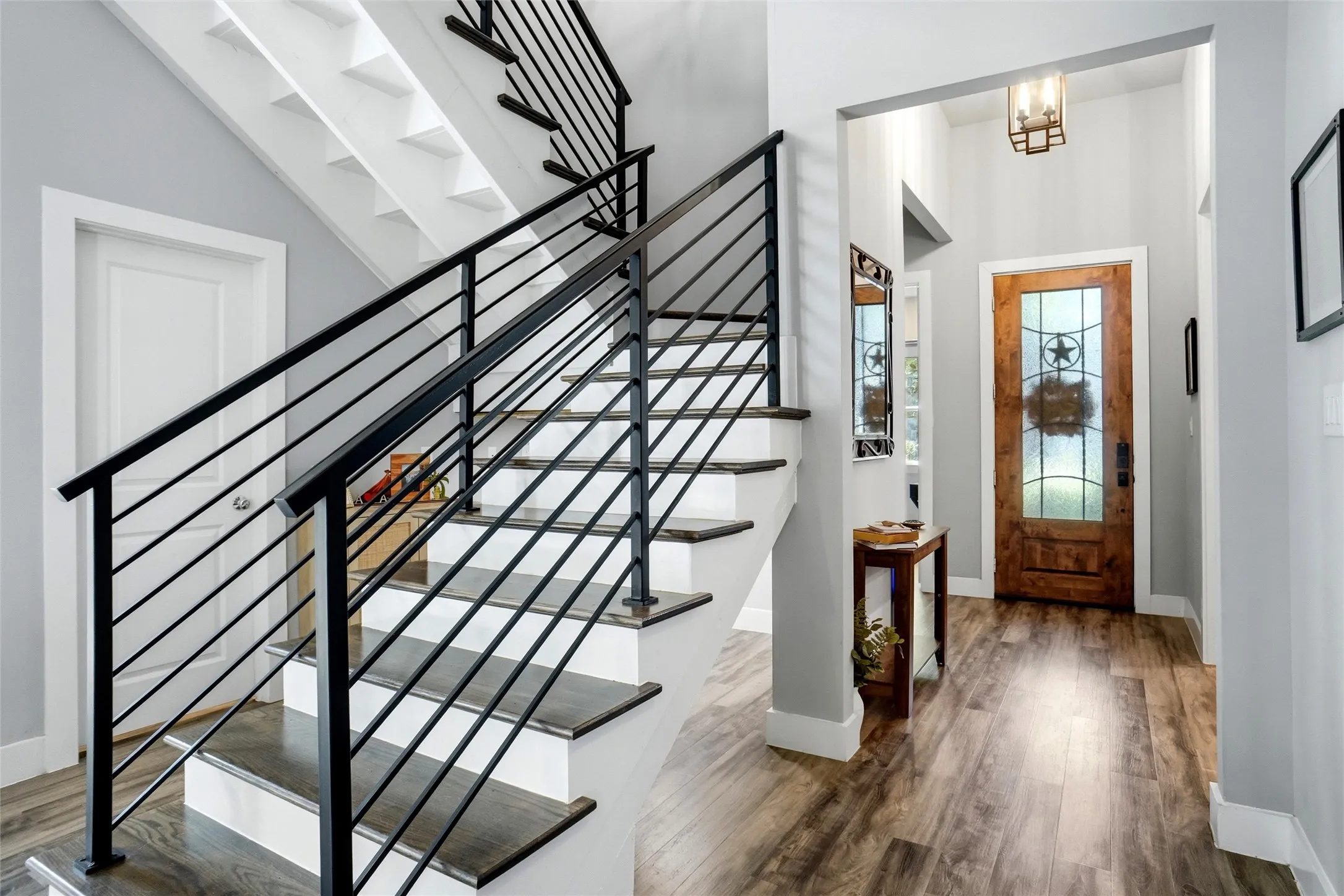 The lovely luxury vinyl floor runs throughout the home with the exception of the upstairs bathroom which is tiled.  The stairs  have a charming cubby tucked beneath the open  staircase, which is the perfect spot for a reading nook, children's play area (think toys out of the way!), or cozy space for your four-legged family members.