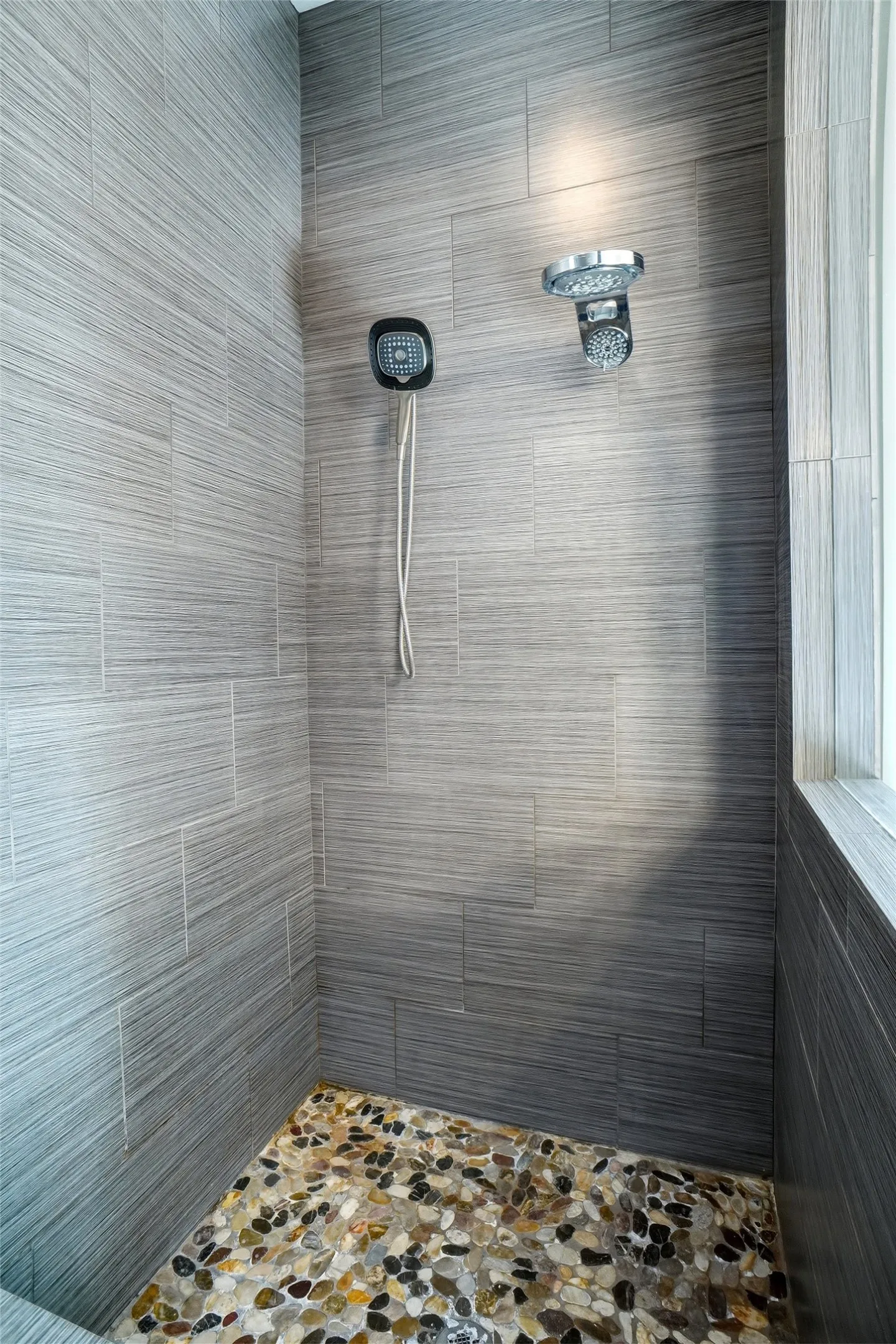 Here is the master shower which measures approximately 6'10 X 4' with multiple stray choices and a bench.