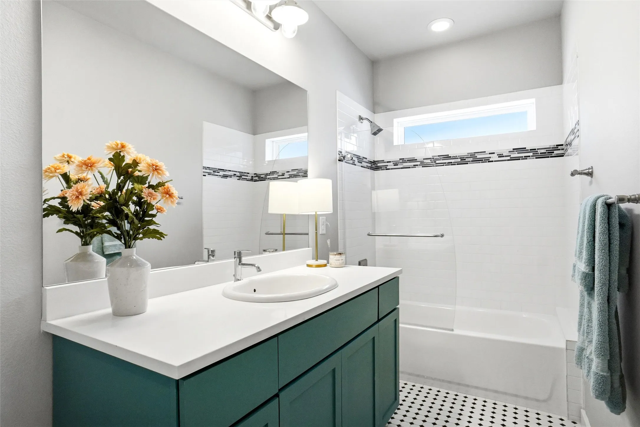 The guest bedroom upstairs is located in the hall between the two bedrooms.  This is a very spacious guest bath.  Note the accent trim and the lovely flooring.