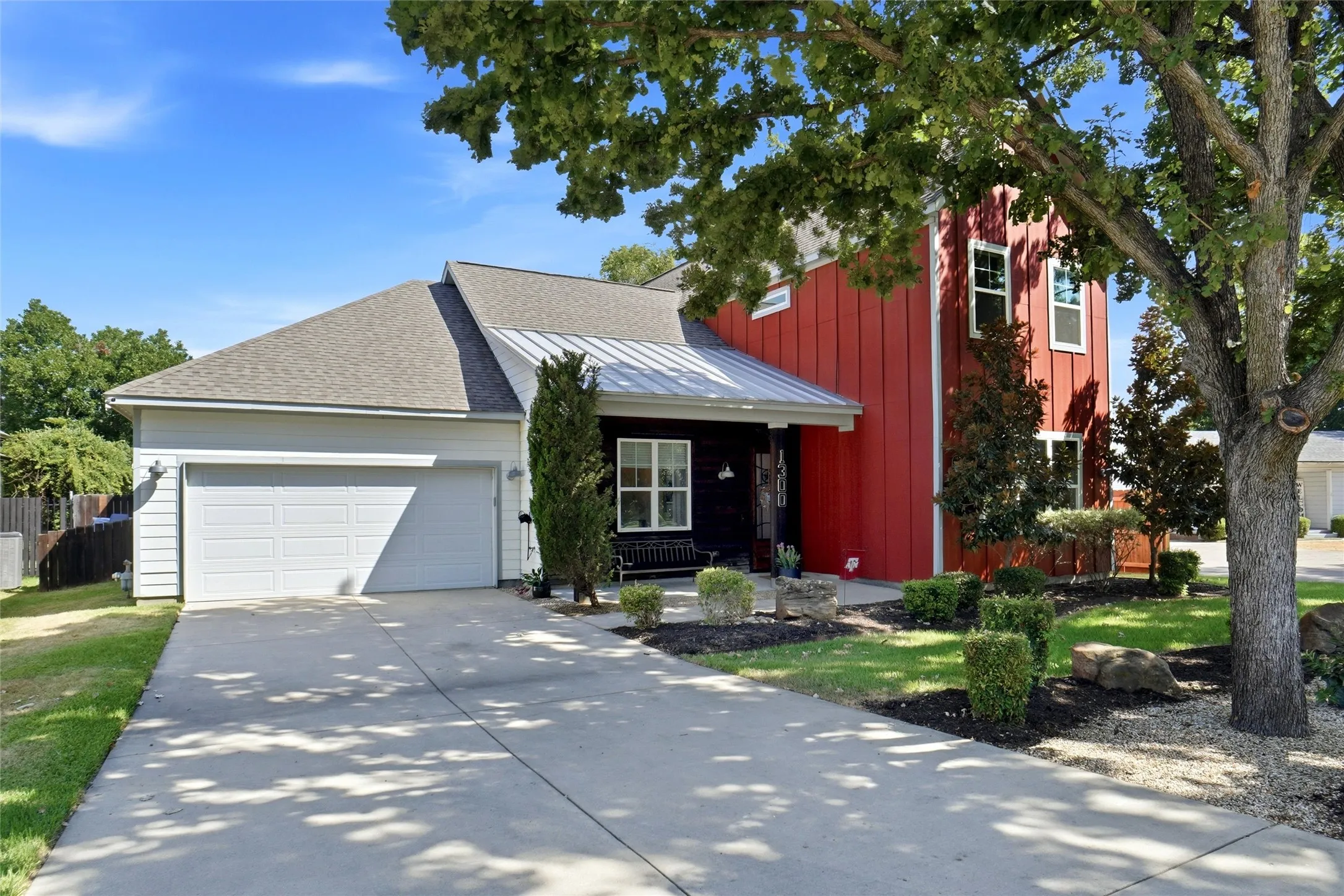 Here is a better view of the front porch, mature trees, and beautiful landscaping. You can also see the 2 magnolias! The sellers also added 4 all-weather security cameras positioned around the property to add exterior monitoring.