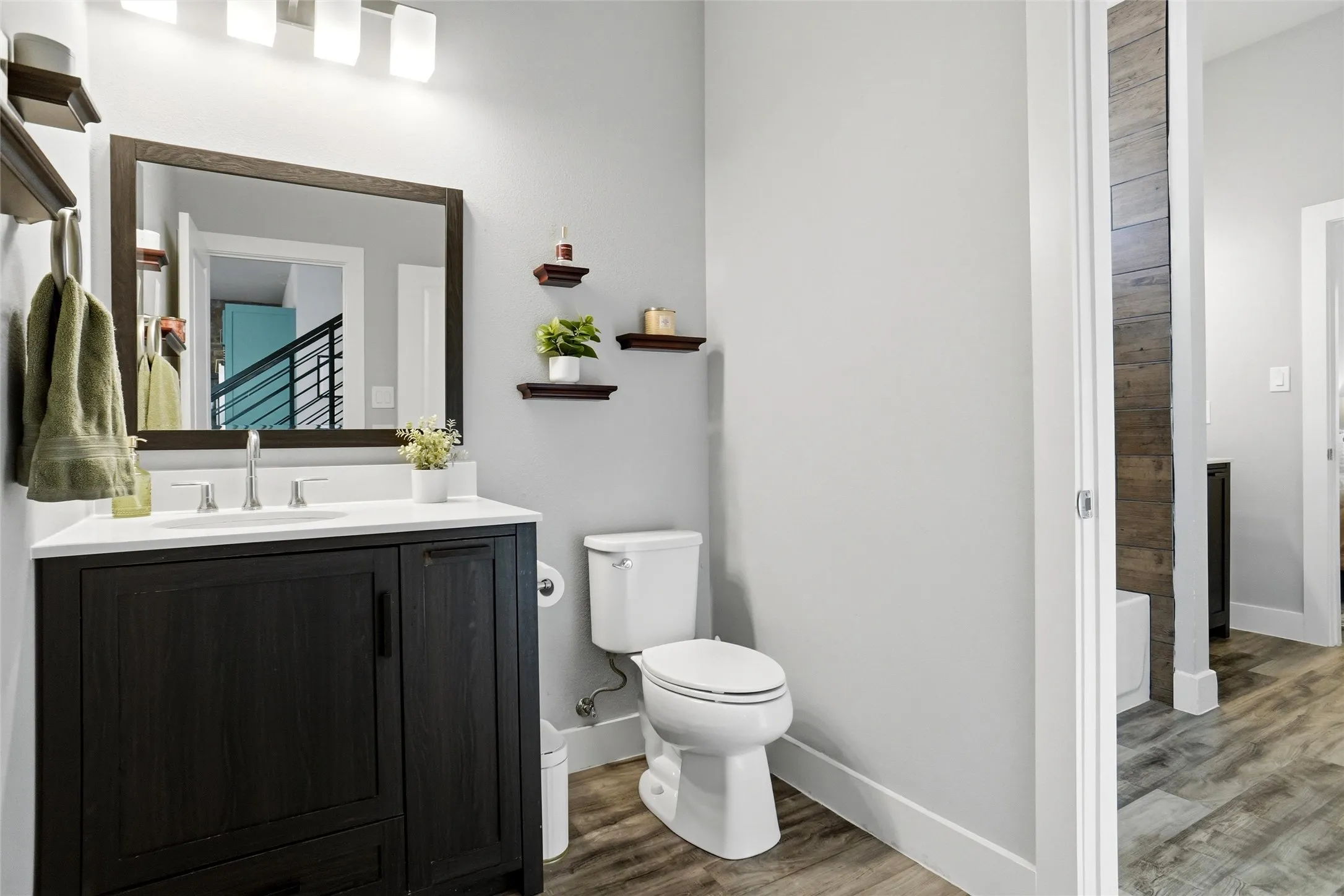 This is the half bath downstairs, part of the 2nd ensuite.