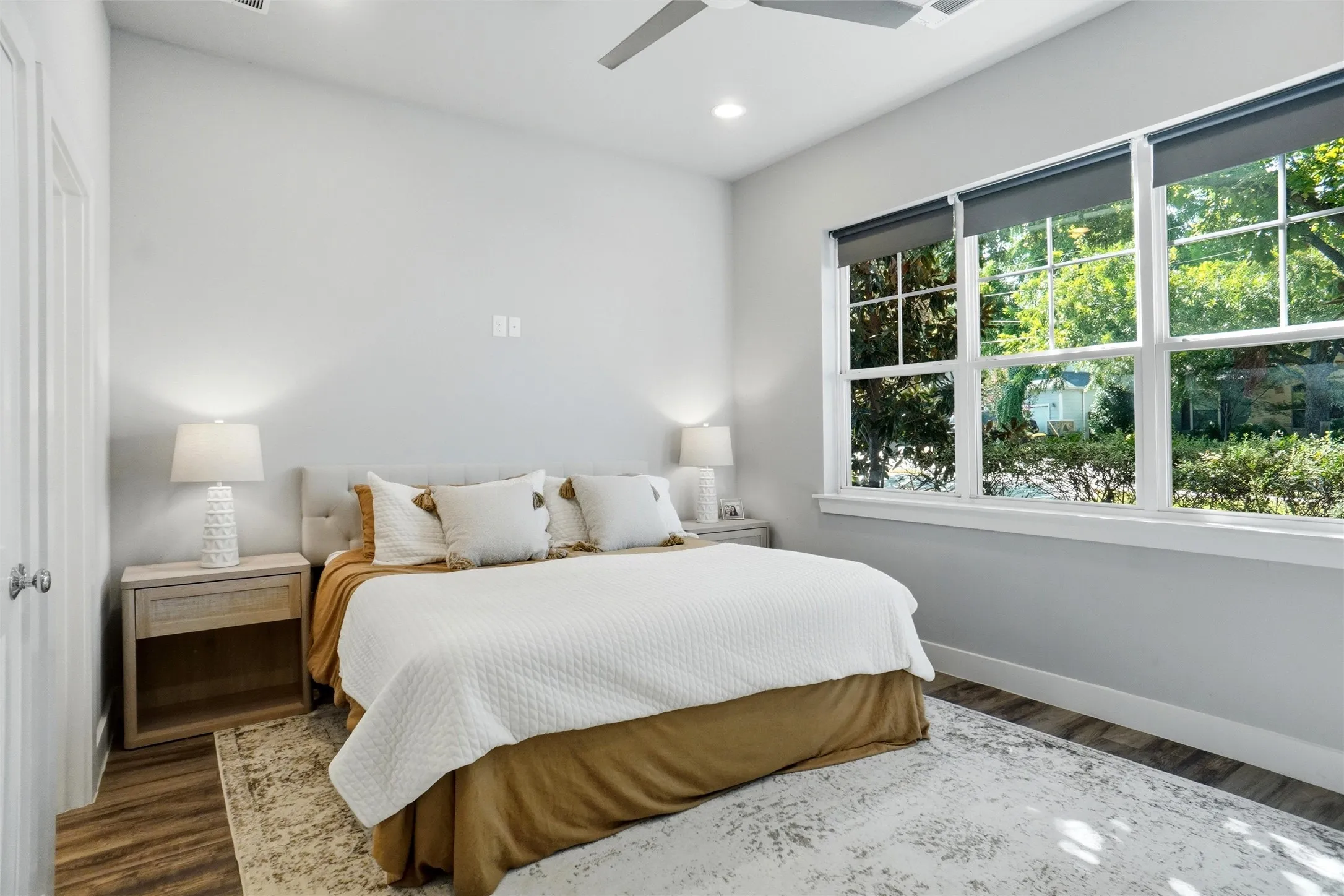 This is the second bedroom downstairs and is  the front of the home.  This is the room that could serve as a secondary primary ensuite.  There is a full bathroom through the door in the left hand corner.  The other door is a walk-in closet.