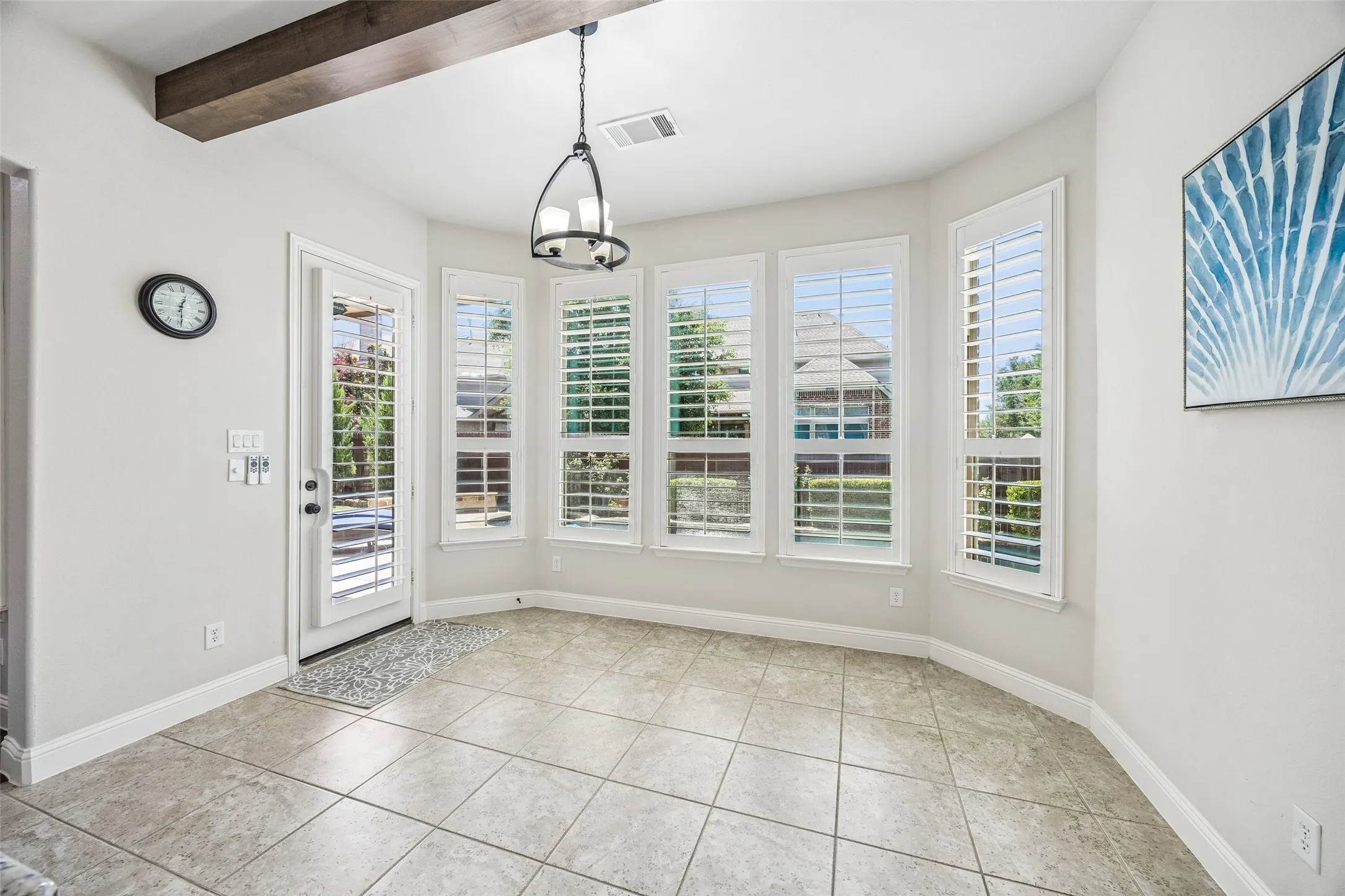 Bay windows flank the second dining area