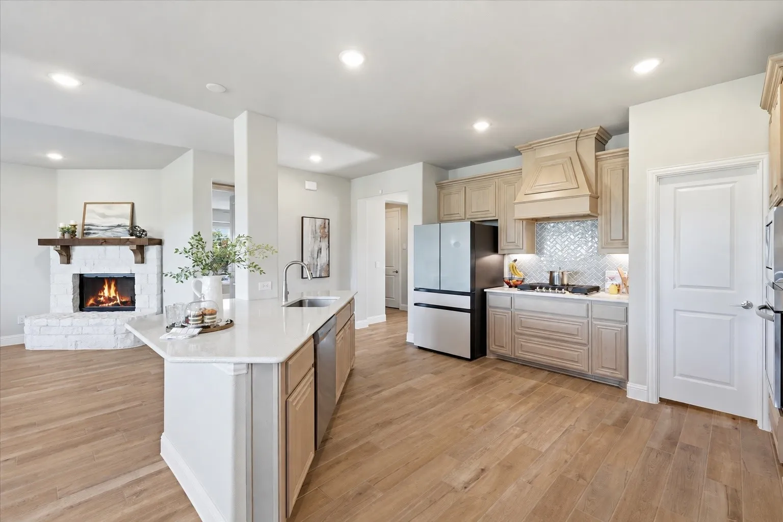 This kitchen!!! Massive amounts of space, gorgeous light wood cabinets with details, upgraded counter tops and herringbone backsplash, gas cook top, large walk in pantry and farm sink!