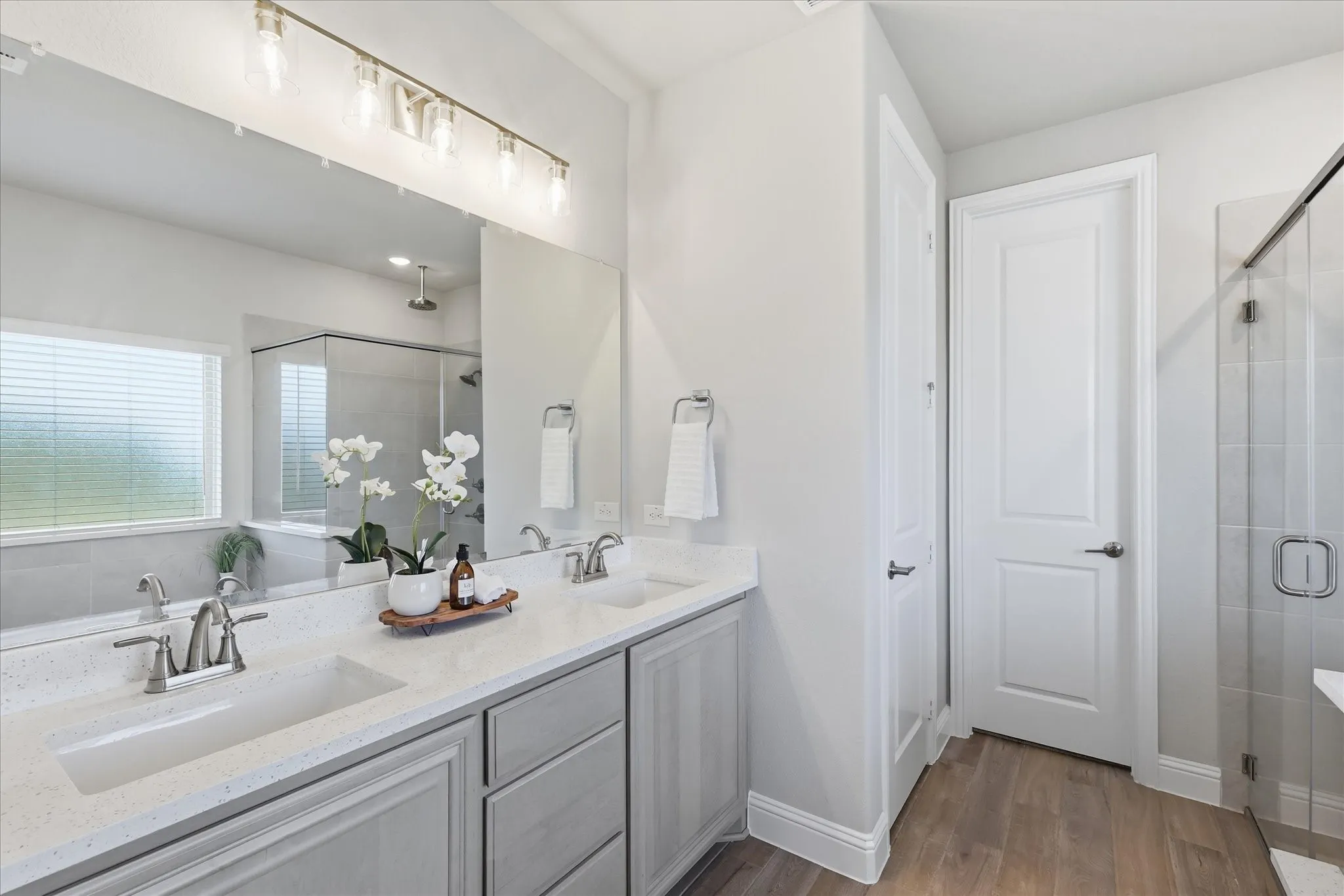 1st floor primary ensuite bath featuring a soaking tub, seperate shower with rainfall head, dual sinks, great vanity and walk in closet!