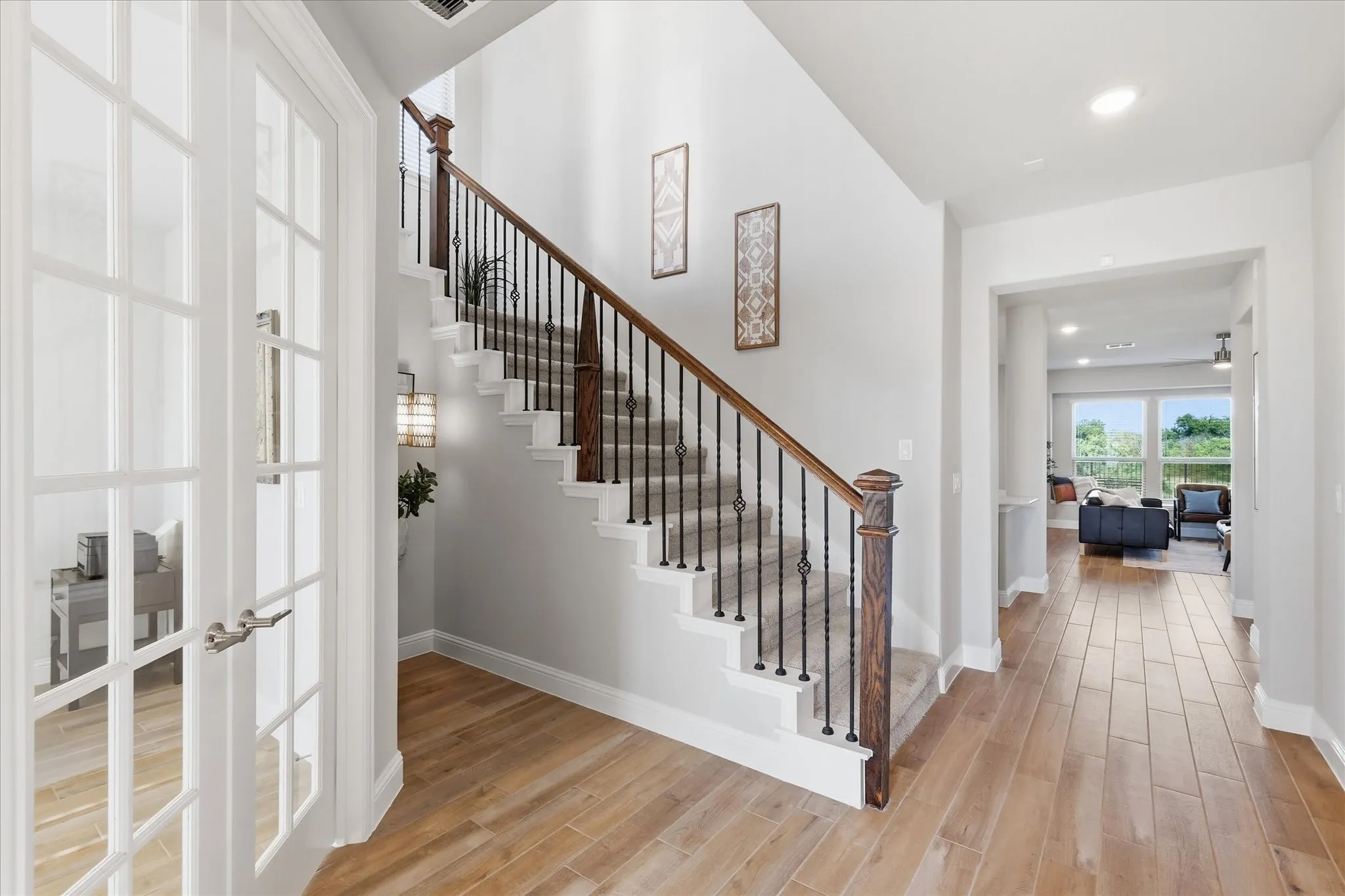 Massive entry with wood look tile, study with french doors, gorgeous staircase with natrual lighting!
