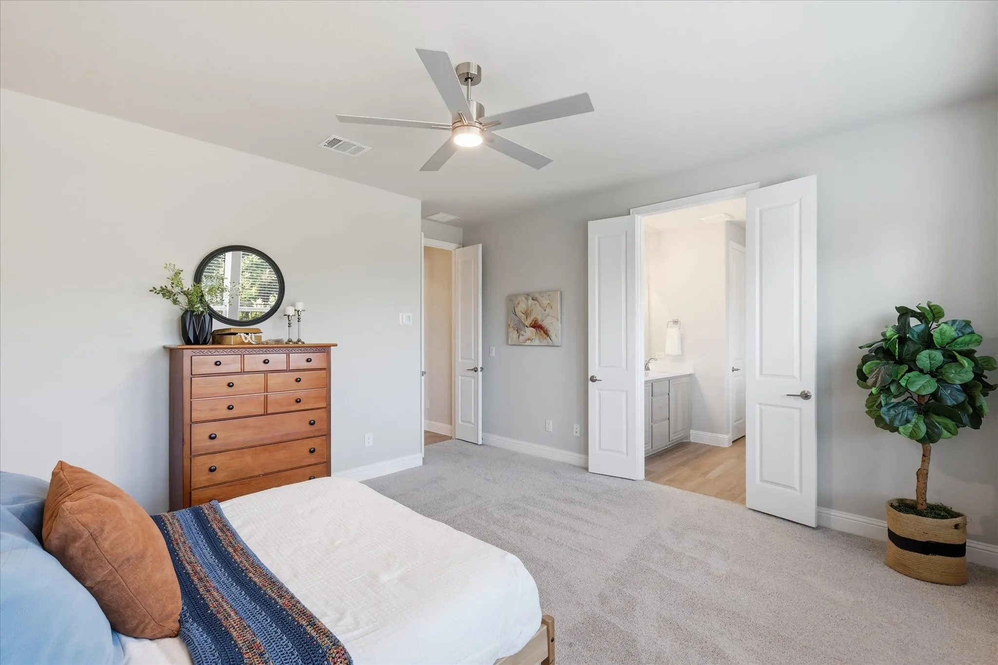 First floor primary bedroom with ensuite bath, french door entry and french doors to bath with natural light and recessed window bay eating!