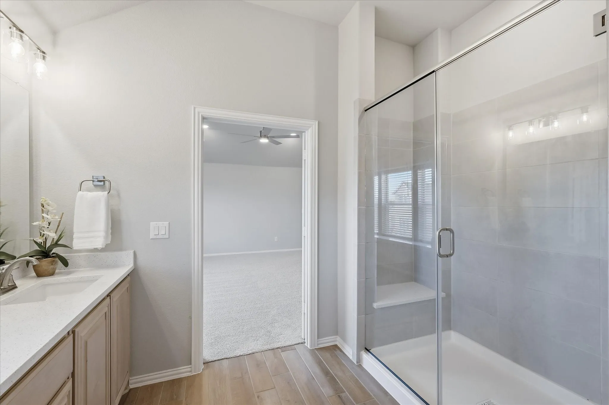 Second primary bathroom with massive shower, large vanity and plenty of counterspace, upgraded countertops and walk in closet!