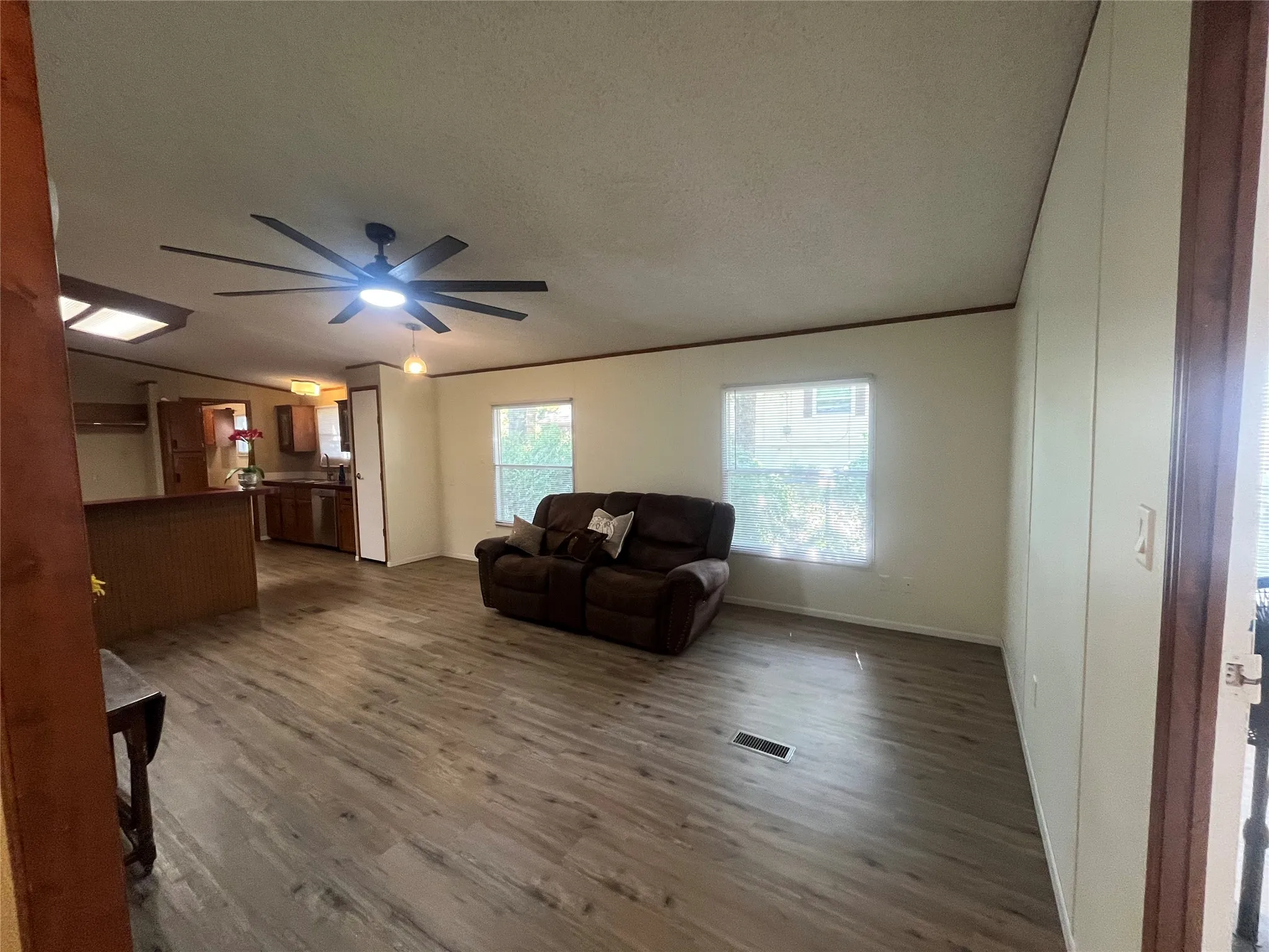 View from Guest Bathroom Door into Family Room and Kitchen.