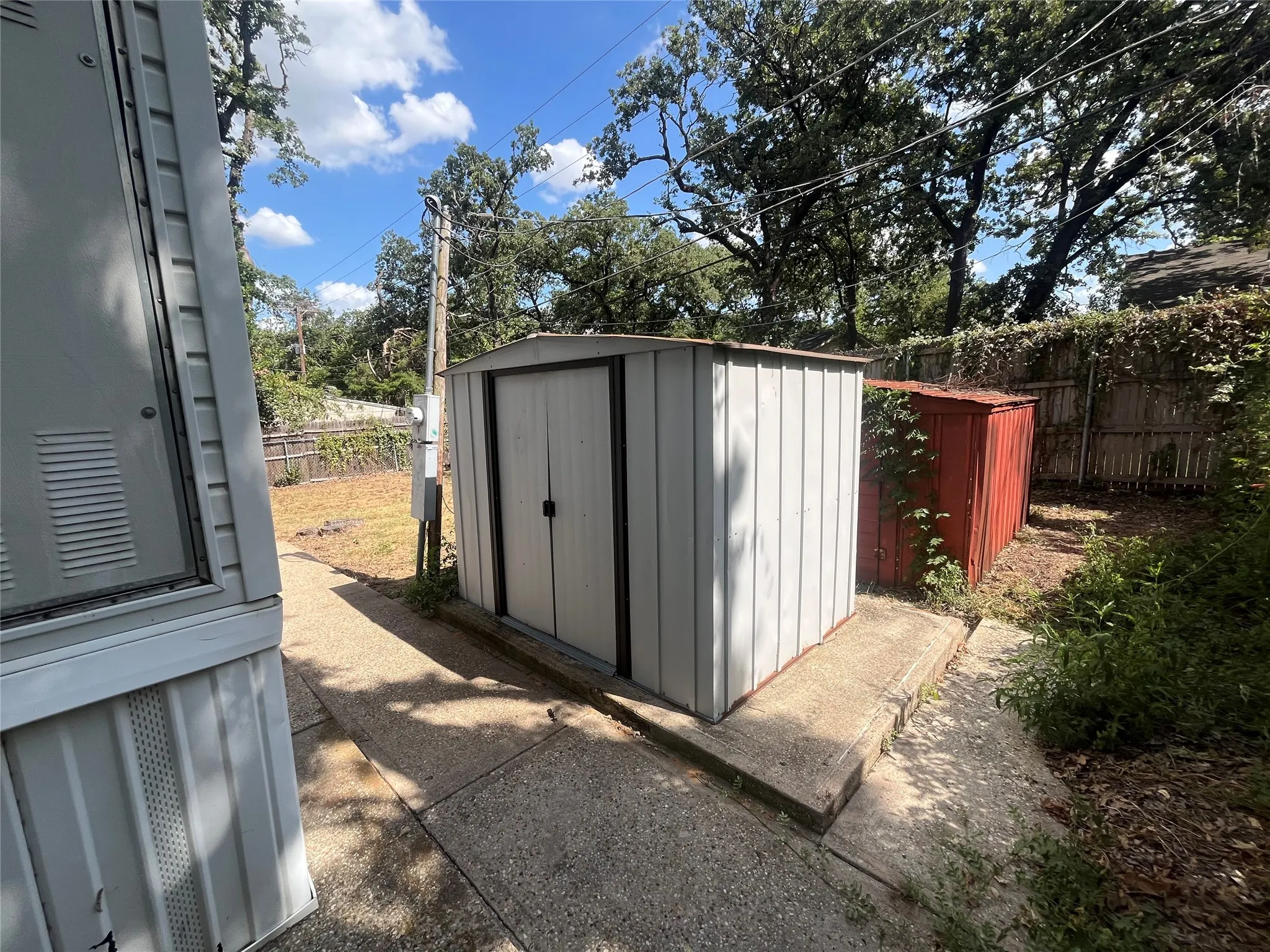 His and Hers Sheds with concrete floors