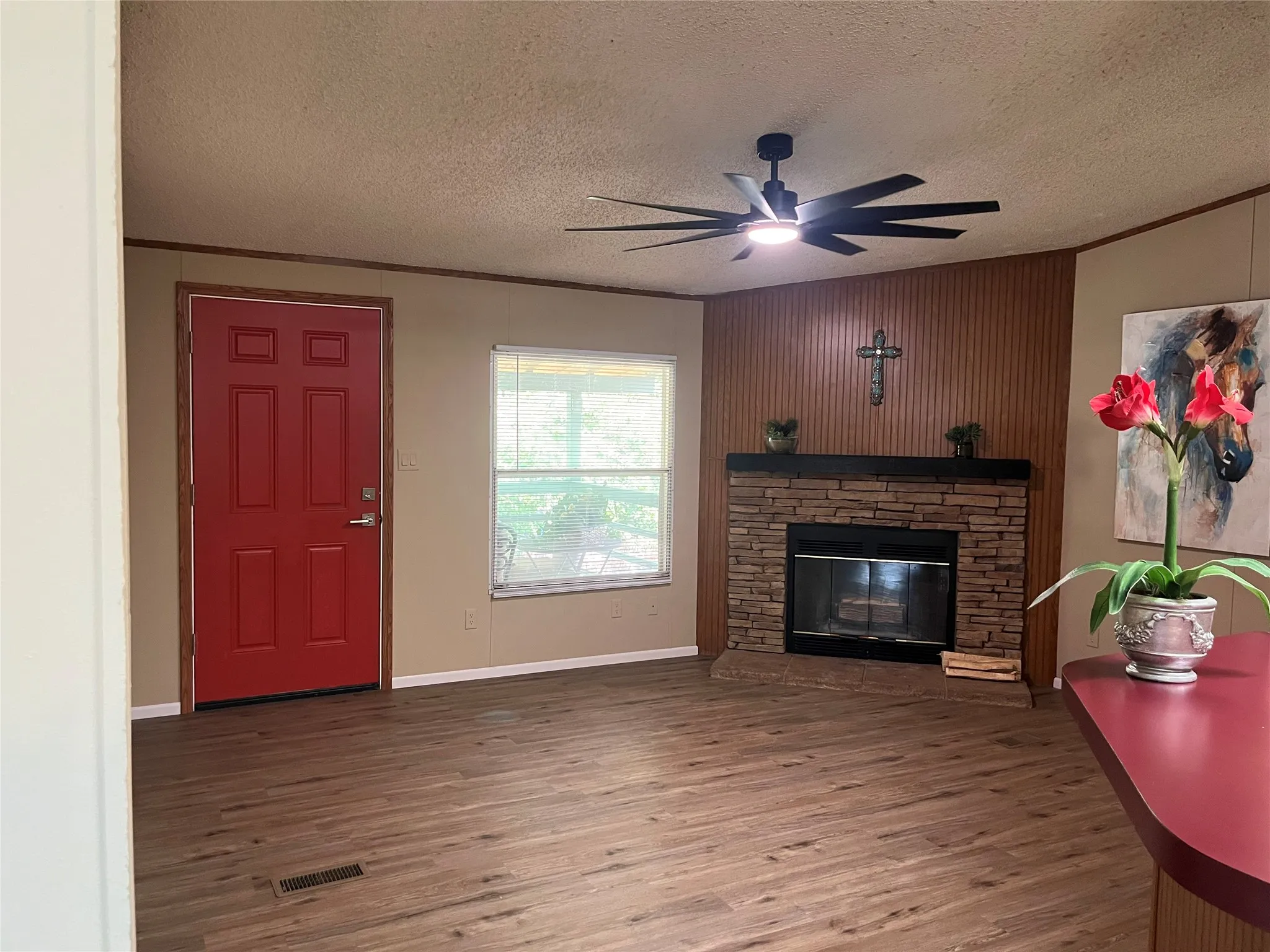 Entry with wood burning fireplace/Modern Ceiling Fan with remote control