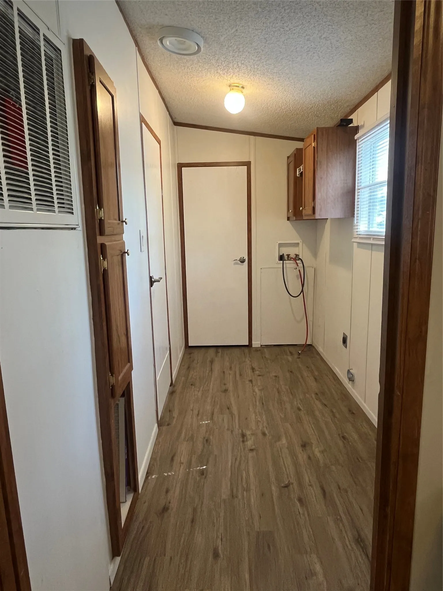Full Size W/D hook ups, large utility closet with built in cabinets.