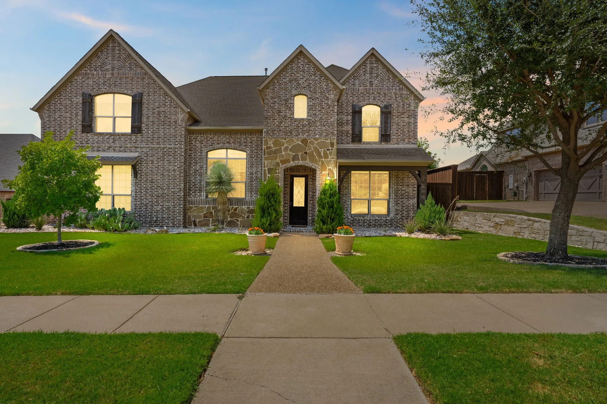 Brick and stone exterior with decorative window shutters