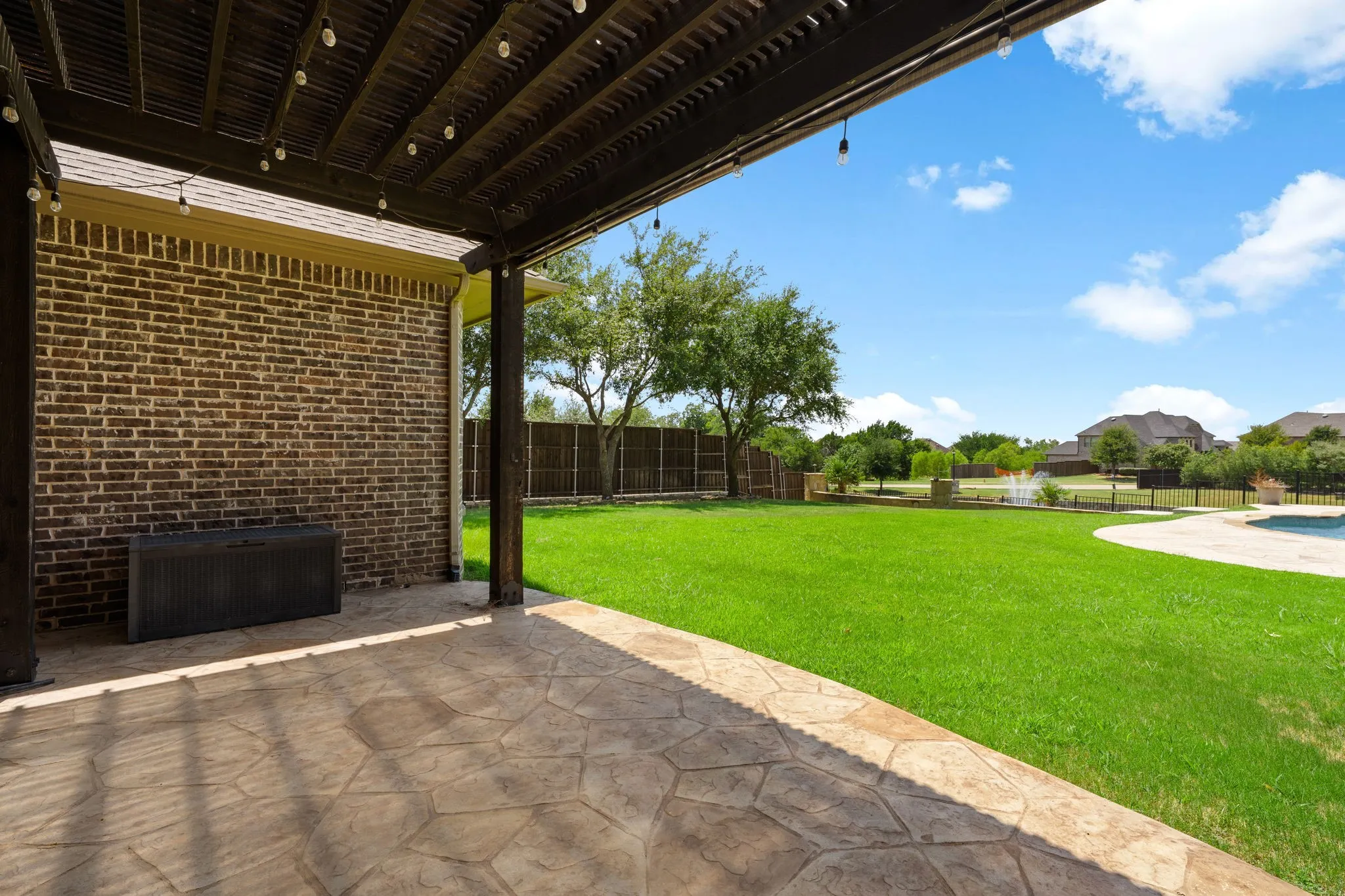 Covered patio with stamped concrete flooring