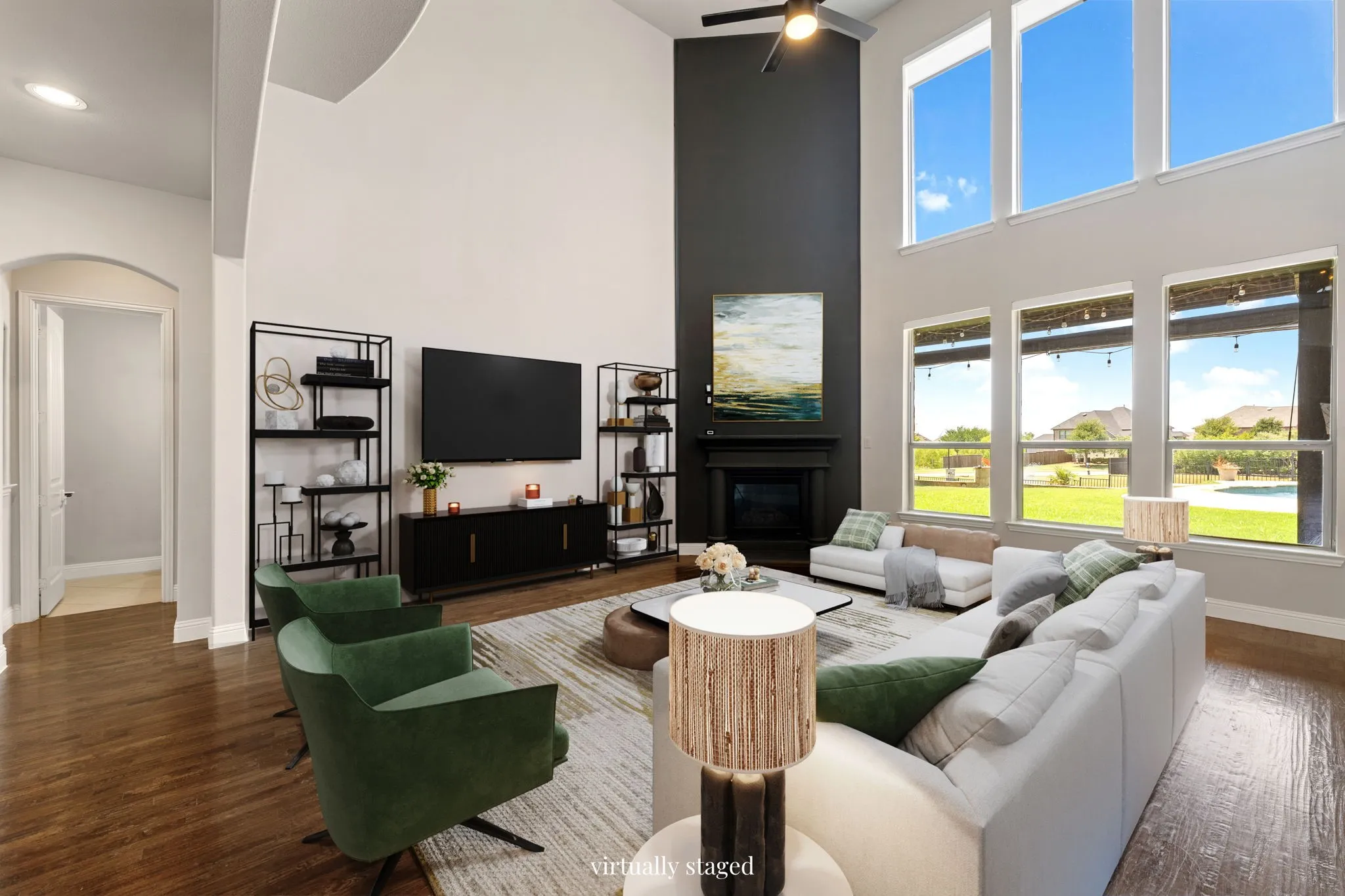 Vaulted ceiling, wood-finish flooring, fireplace, recessed lighting, and expansive windows