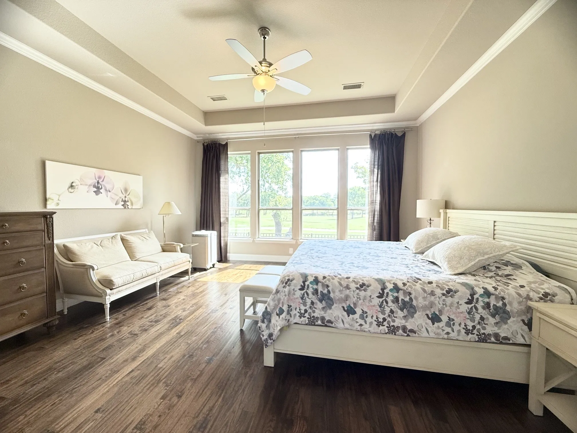 Primary bedroom with a wall of windows