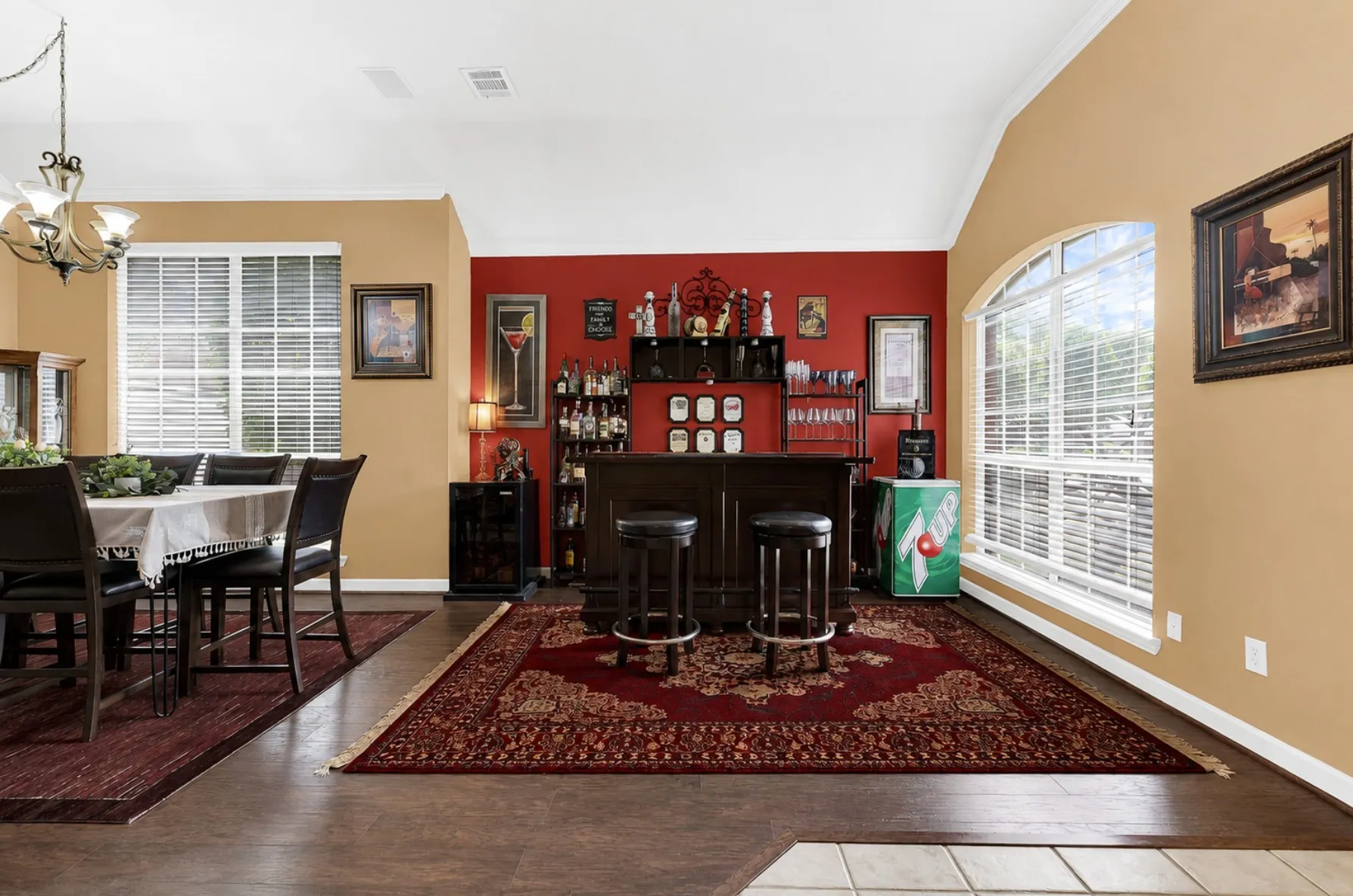 An elegant arched window accents the high pitch of the ceiling, filling every corner with sunshine. Imagine unwinding here after a long day with a cozy evening nightcap in your own peaceful sanctuary.