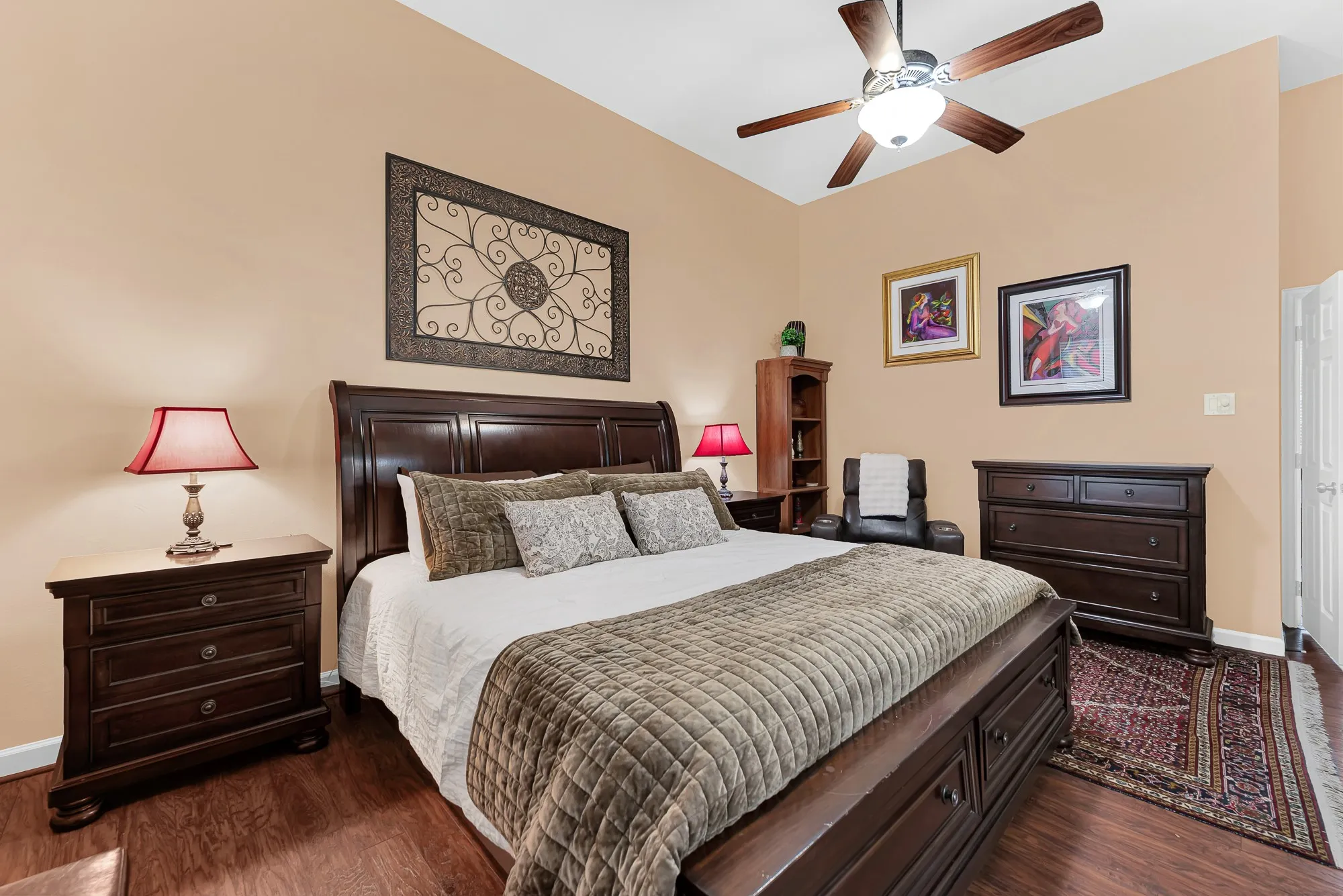 A expansive primary wall offers generous proportions, beautifully balancing soft overhead lighting with comfortable floor space. Picture unwinding with a glass of wine and your favorite playlist after a busy workday.