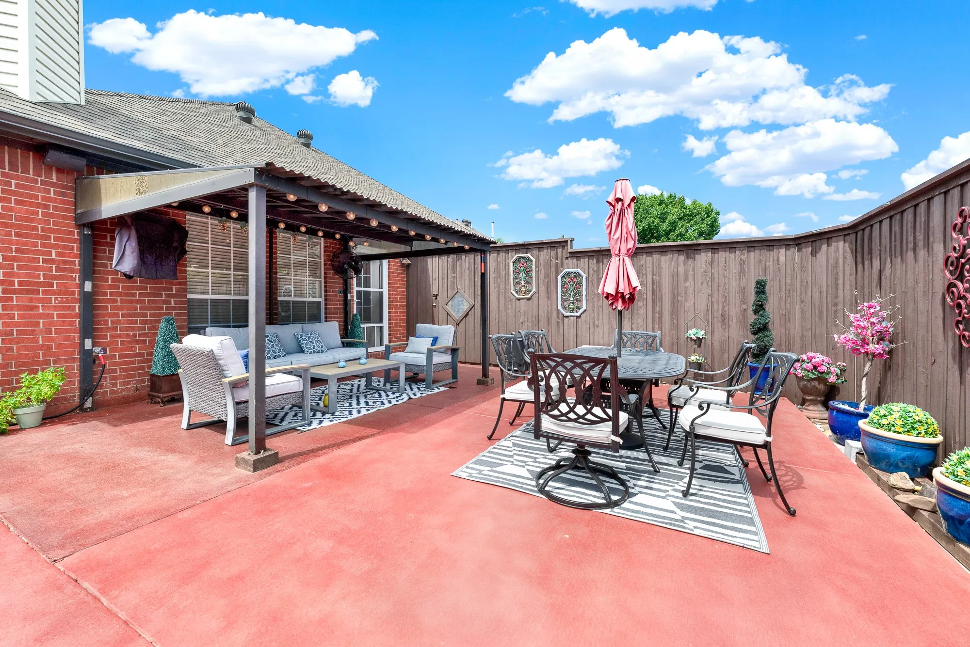 The sweeping patio layout offers effortless outdoor flow right off the main home entrance. Visualize gathering the entire family outside for alfresco dining under warm blue skies
