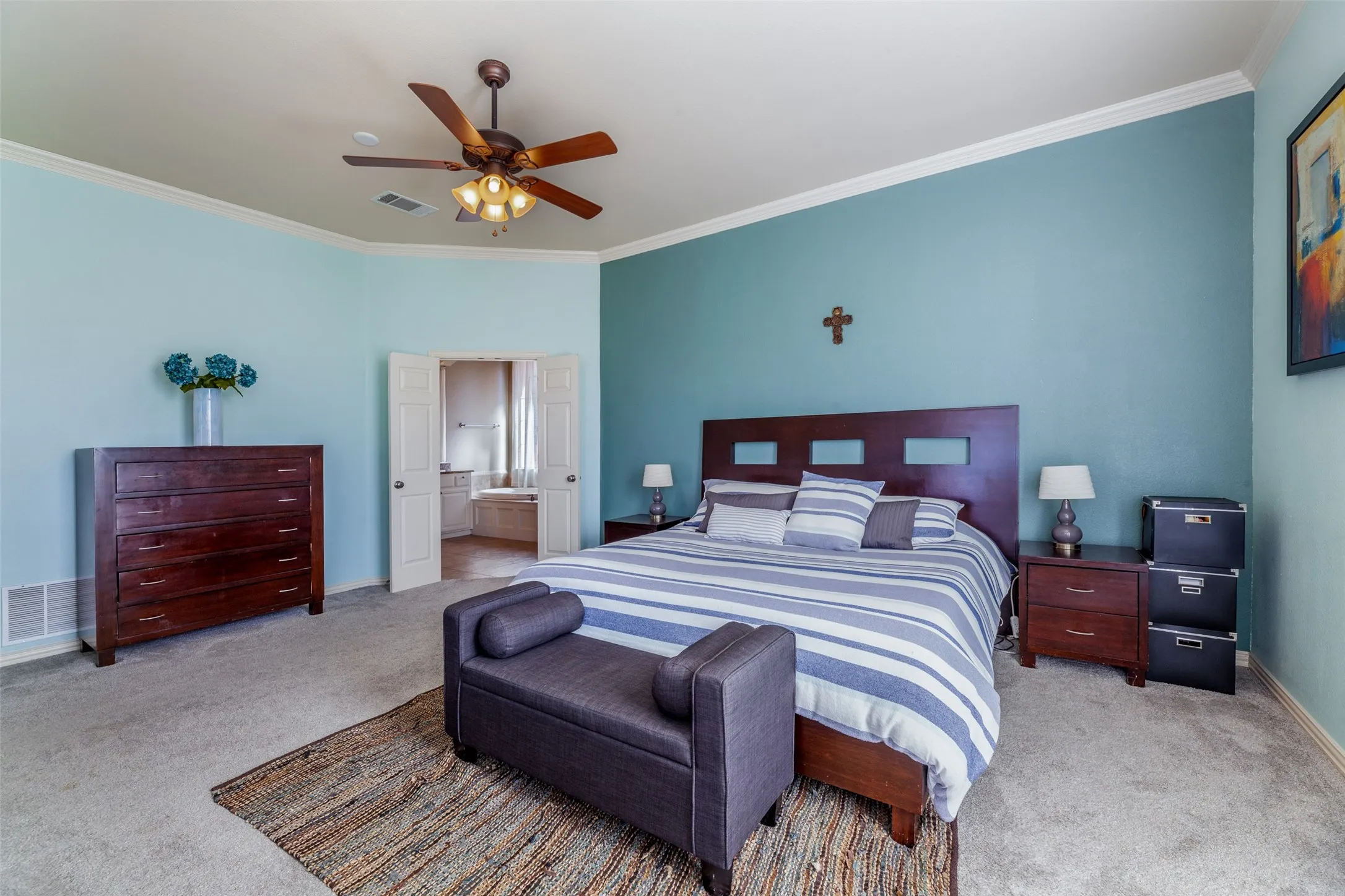Bedroom featuring crown molding, carpet floors, and visible vents