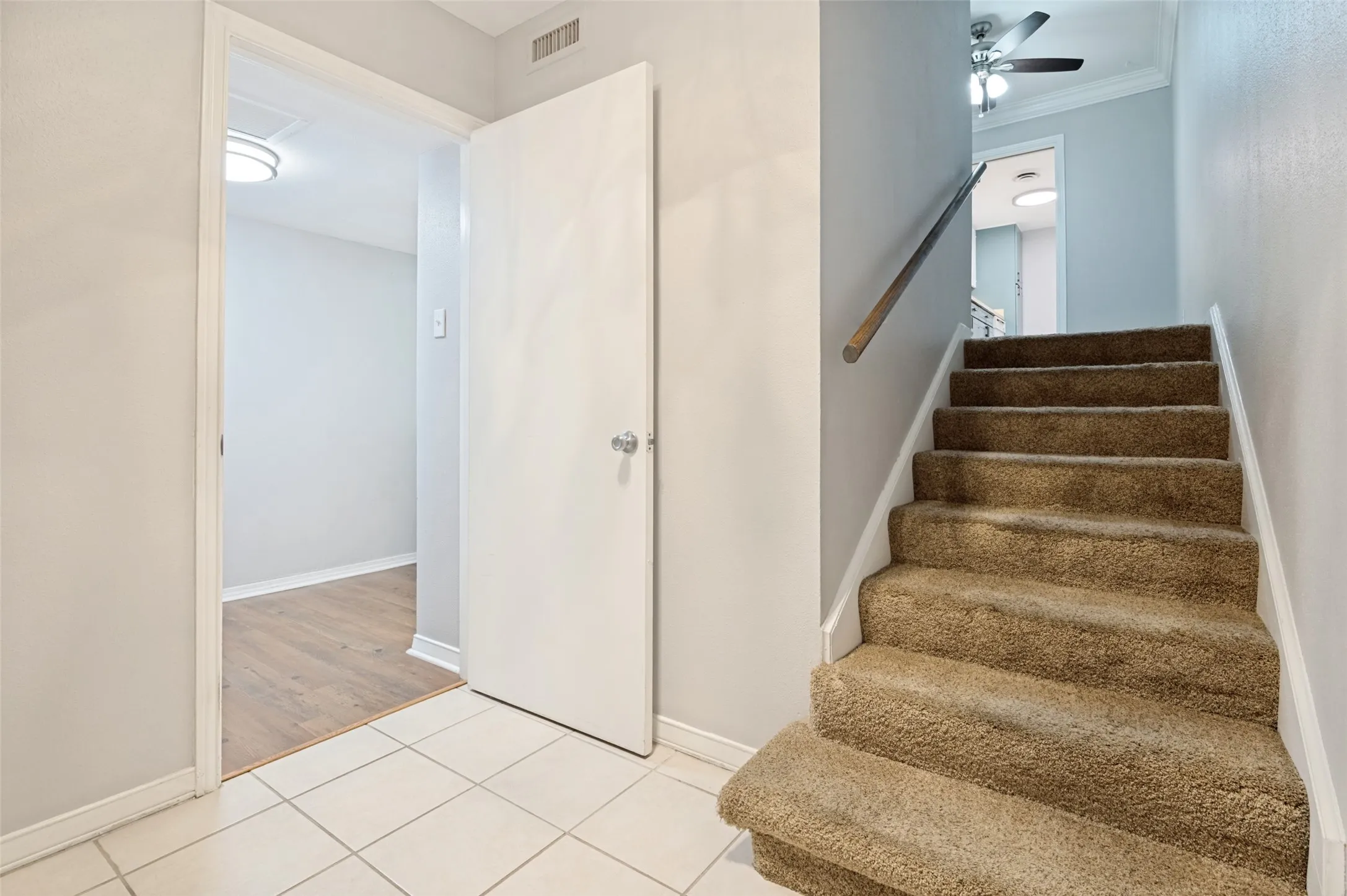 You walk in to the condo and your primary bedroom is on the left, the stairs lead up to the kitchen and living area.