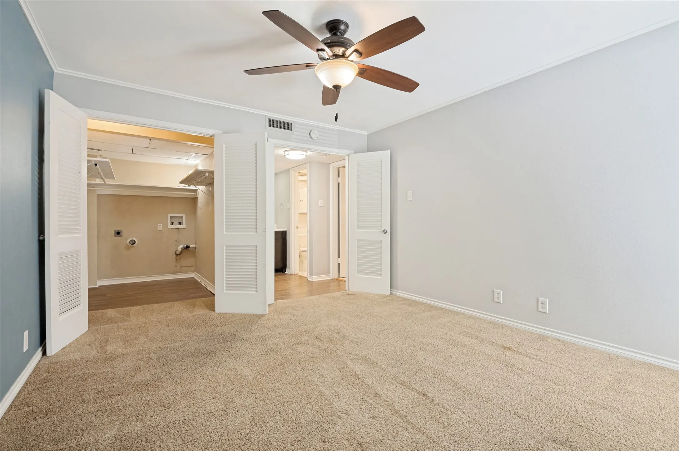 Primary bedroom with walk in closet and bathroom on the left.  Washer Dryer facilities in the closet so you don't have to go to the nearby facilities.