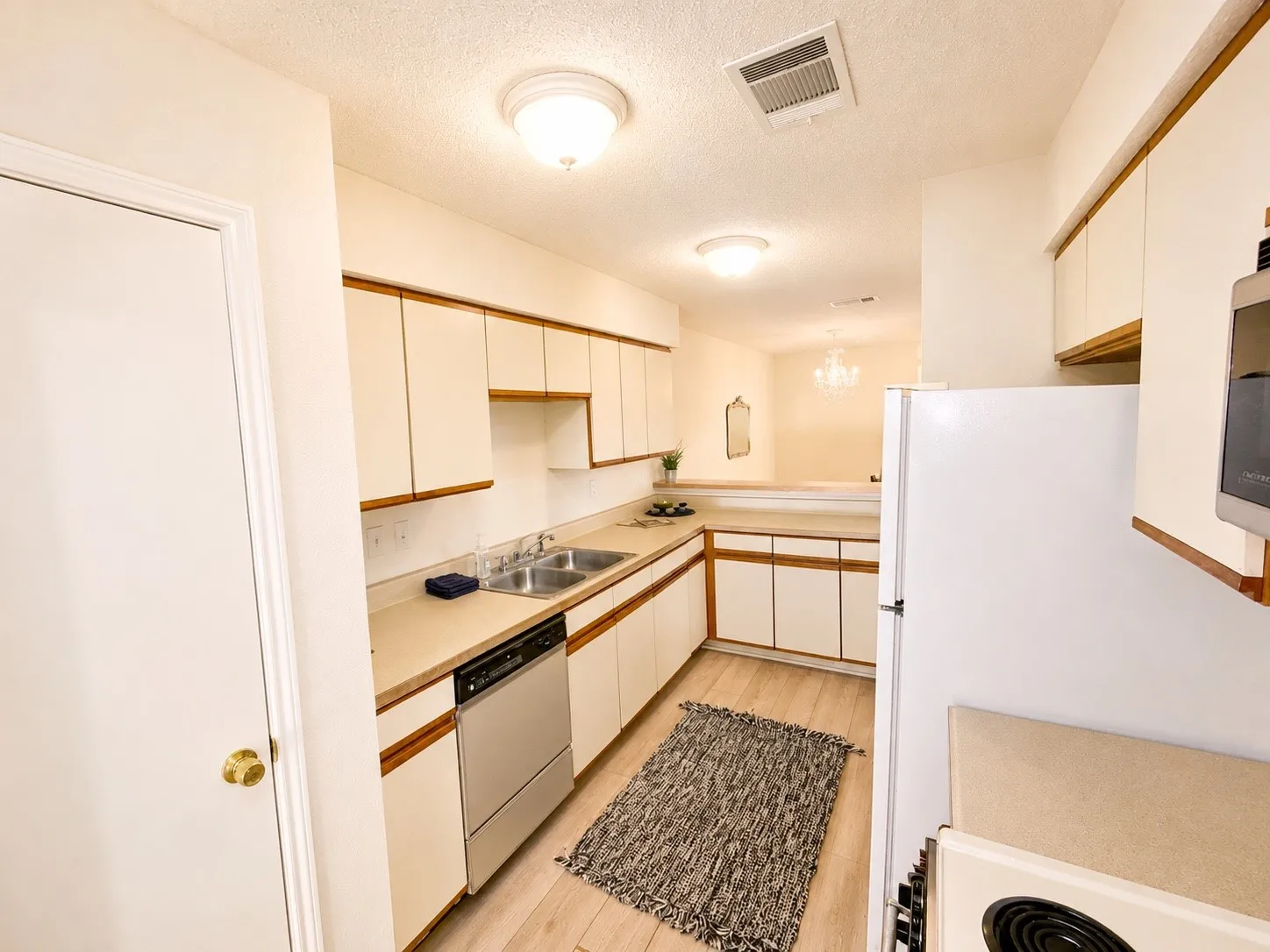 View of kitchen from the garage and laundry room area.