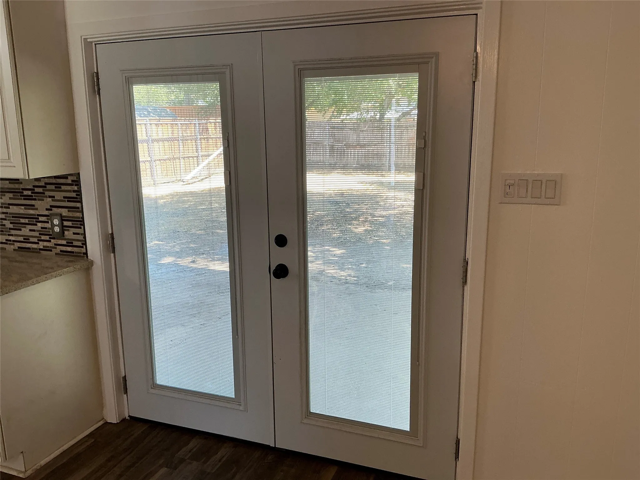 French doors with mini blinds built in.

