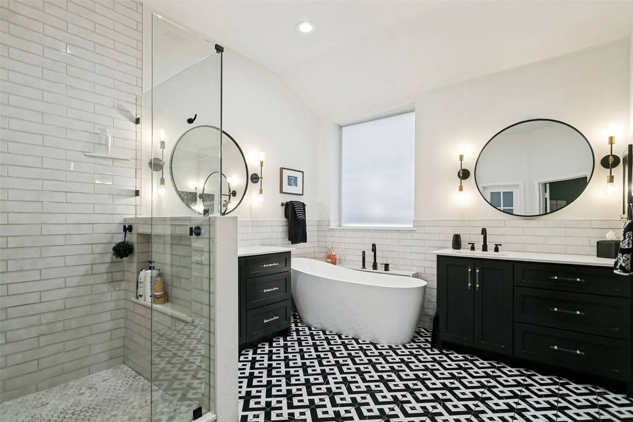 Updated primary bath with his and her sinks, rain shower head and soaking tub
