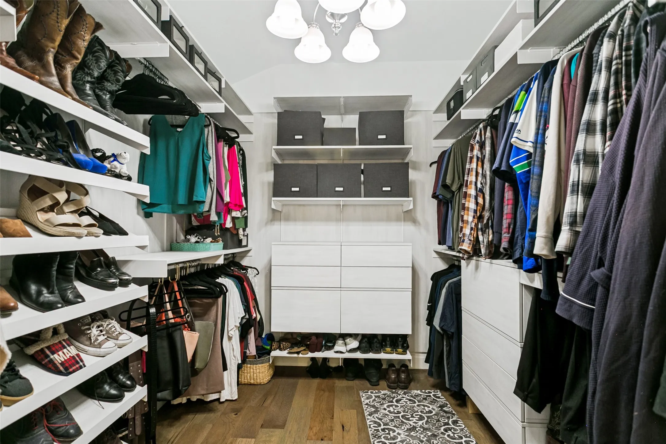 huge walk in primary closet with great closet system