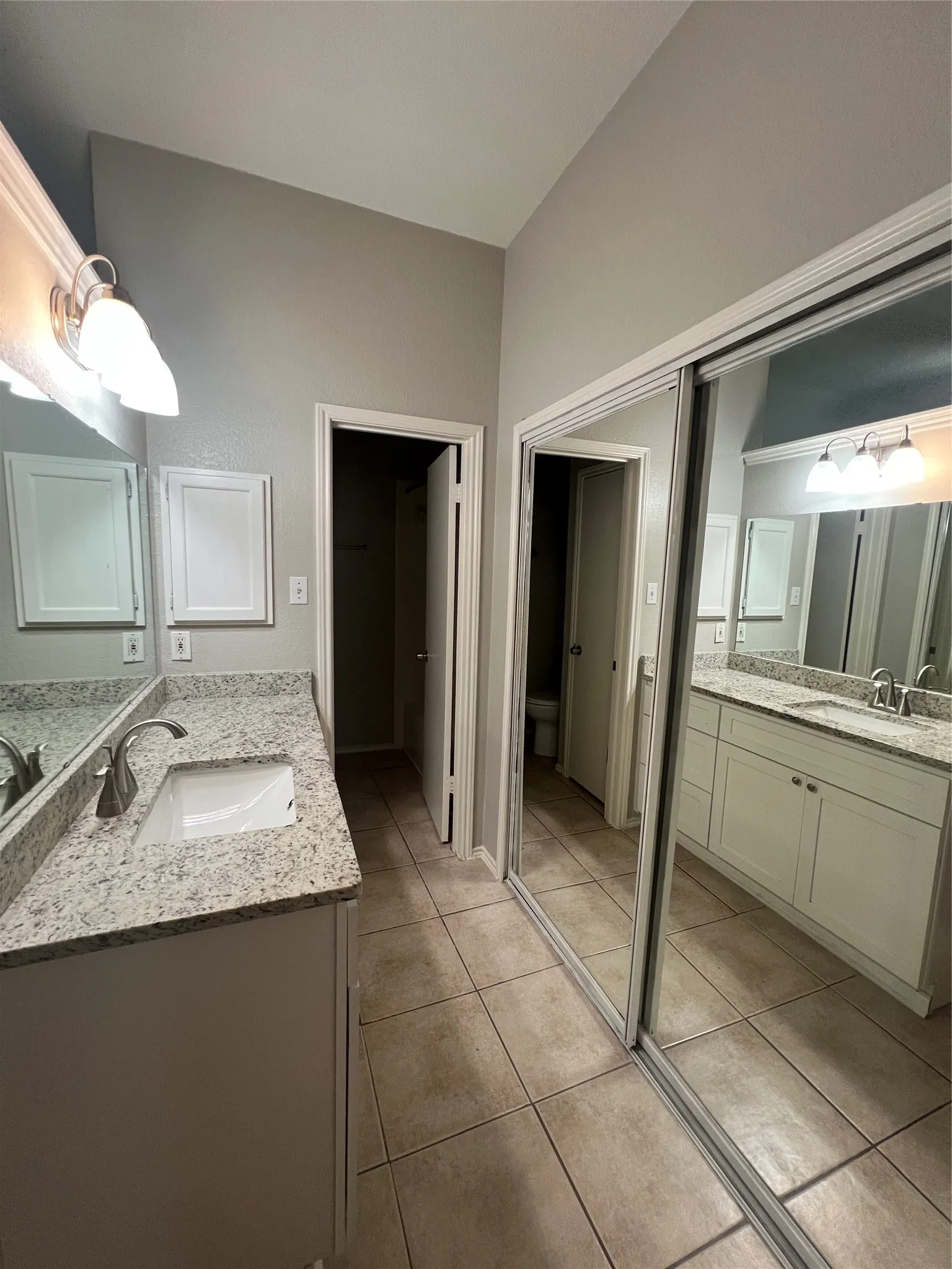  vanity with undermount sinks and light-toned countertops