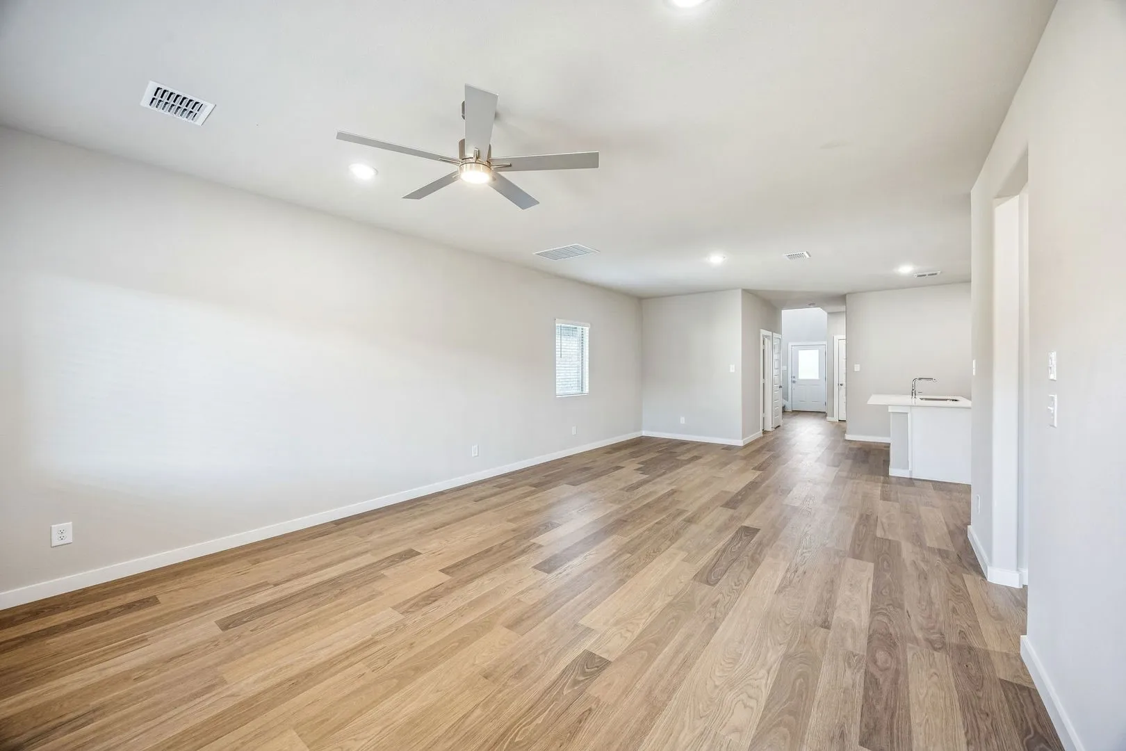 Living and Dining Room in the Willow home plan by Trophy Signature Homes – REPRESENTATIVE PHOTO
