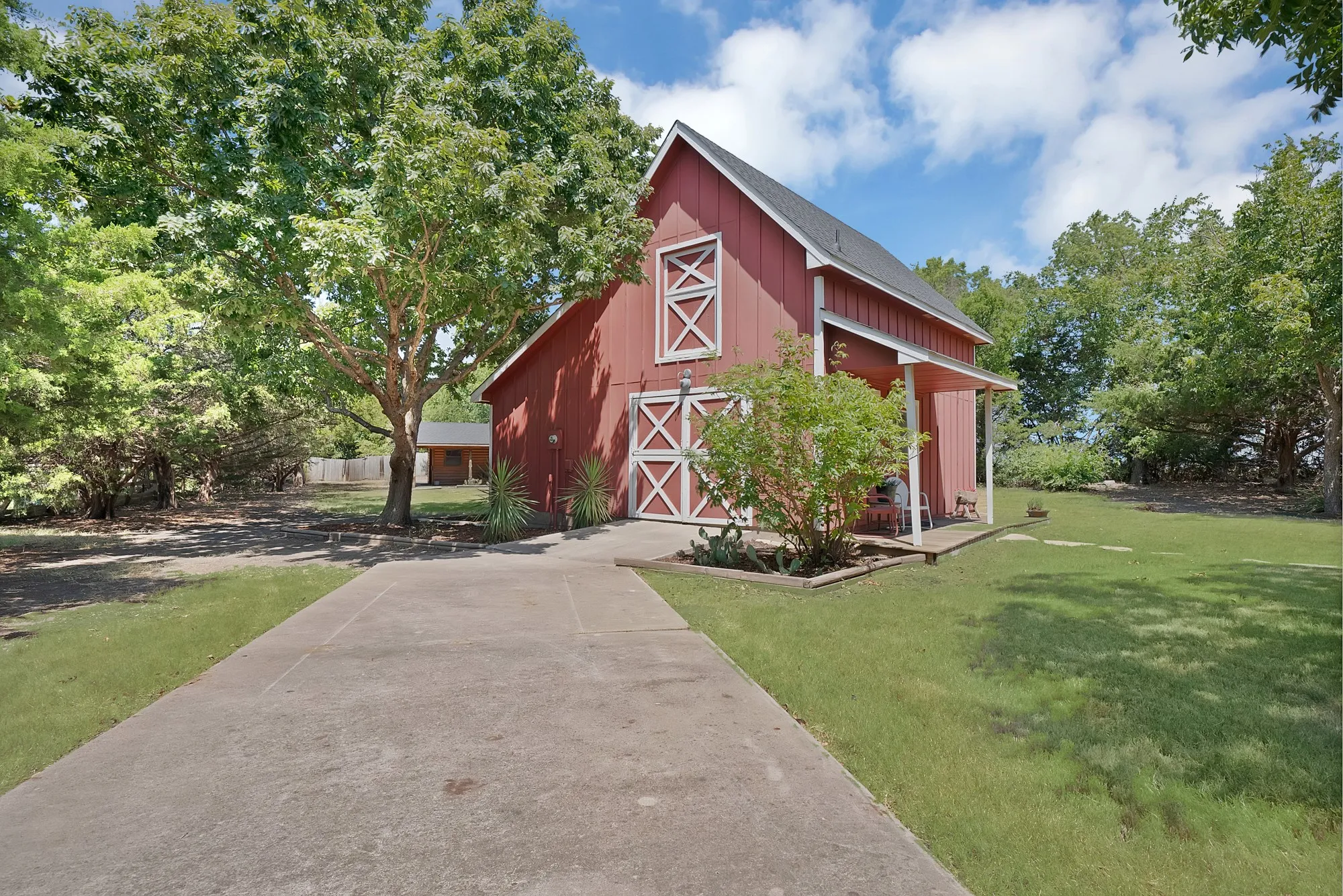 2-story Barn with slide-barn door and two additional entry doors.