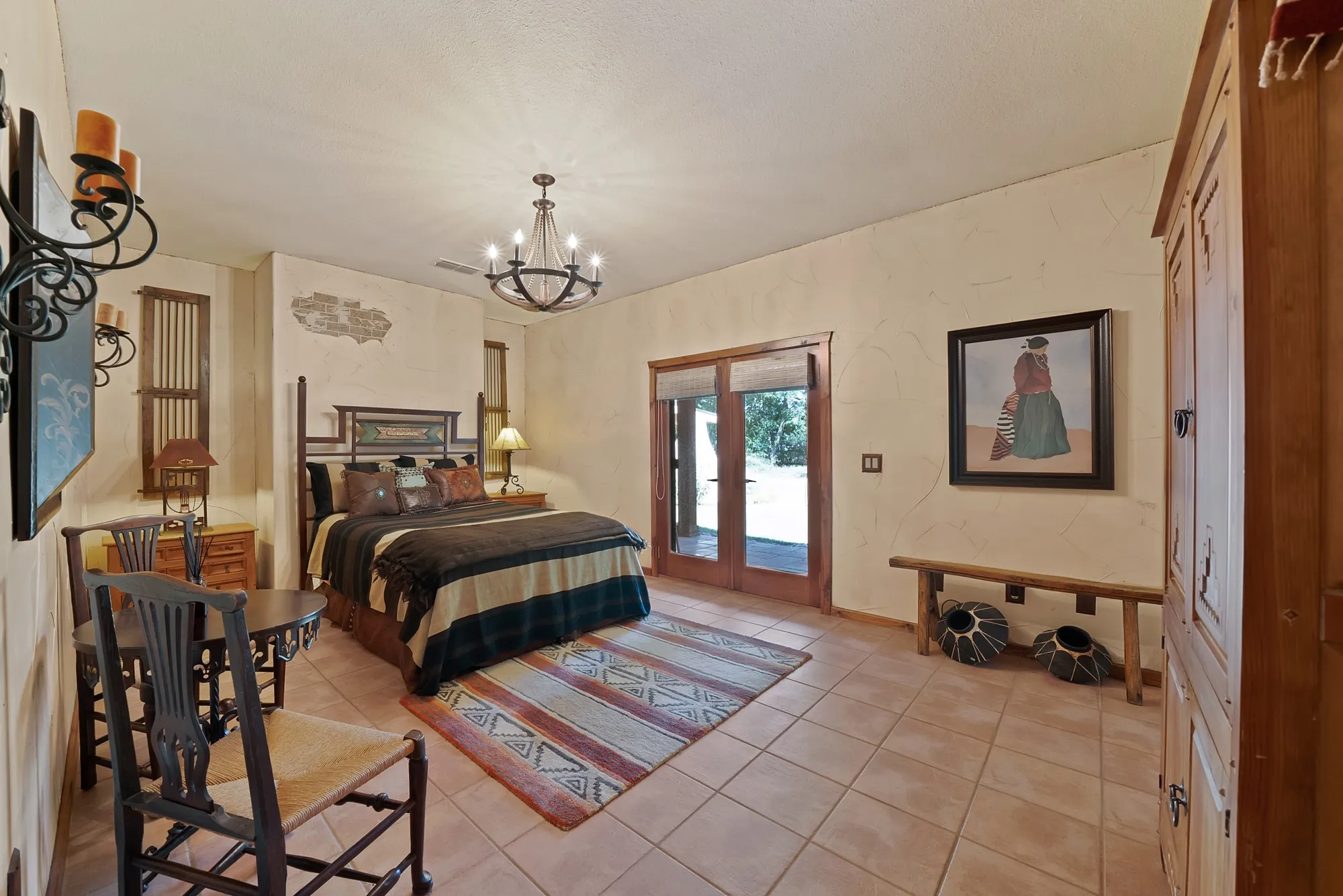 Primary bedroom with access to the backyard veranda.