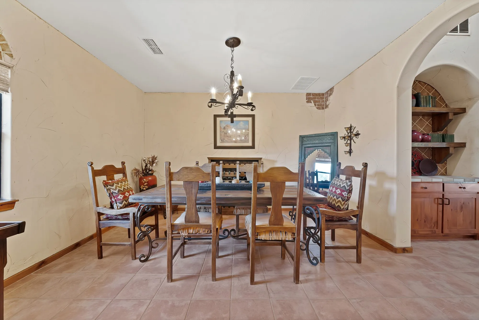 Dining room with brick wall accent and Butler's pantry to the right.