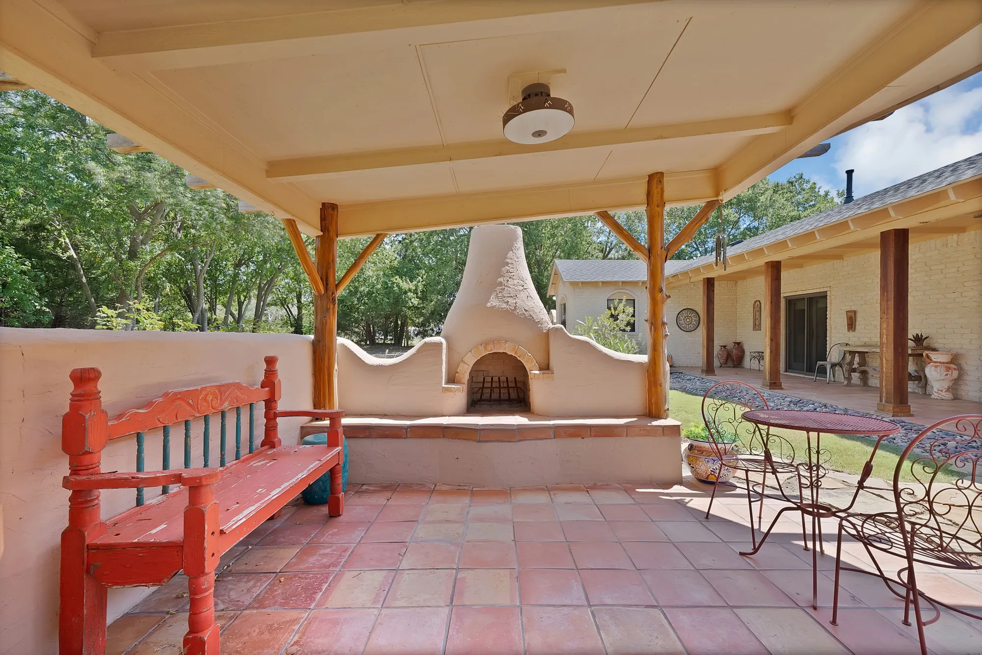 Fireplace with hearth for additional seating.