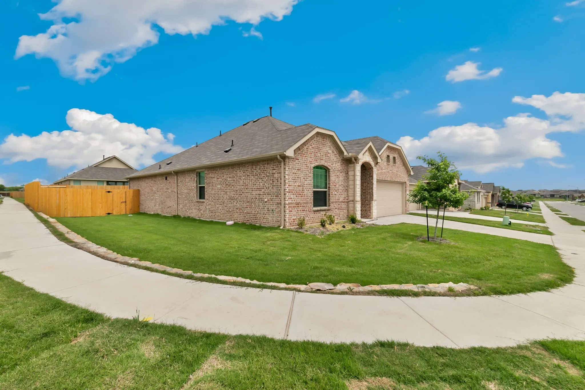 View of front of home with a front lawn and a garage