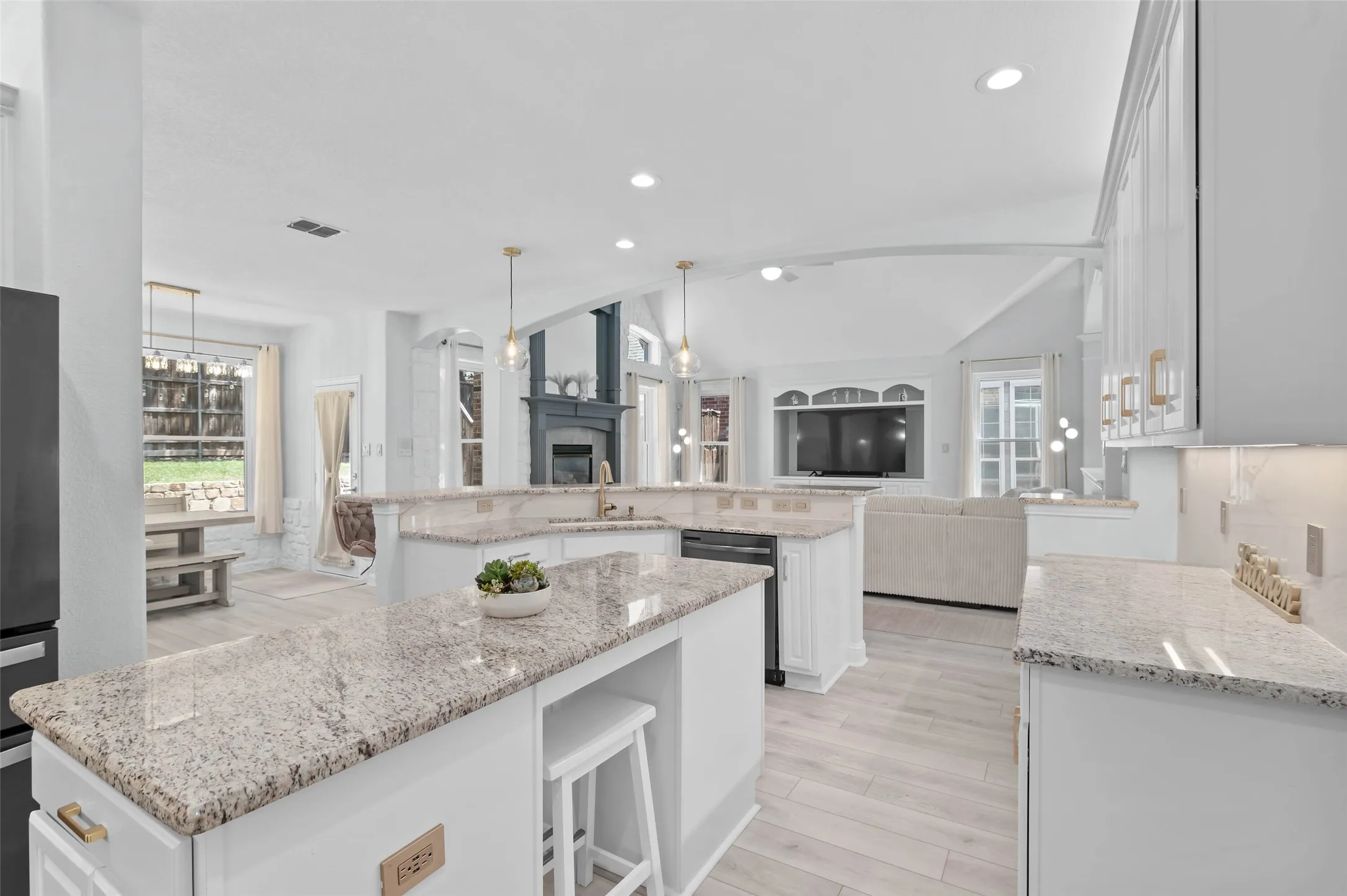Entertaining large groups is a breeze in this large kitchen open to the formal dining, lvg room, breakfast nook, bar seating and access to the back patio.