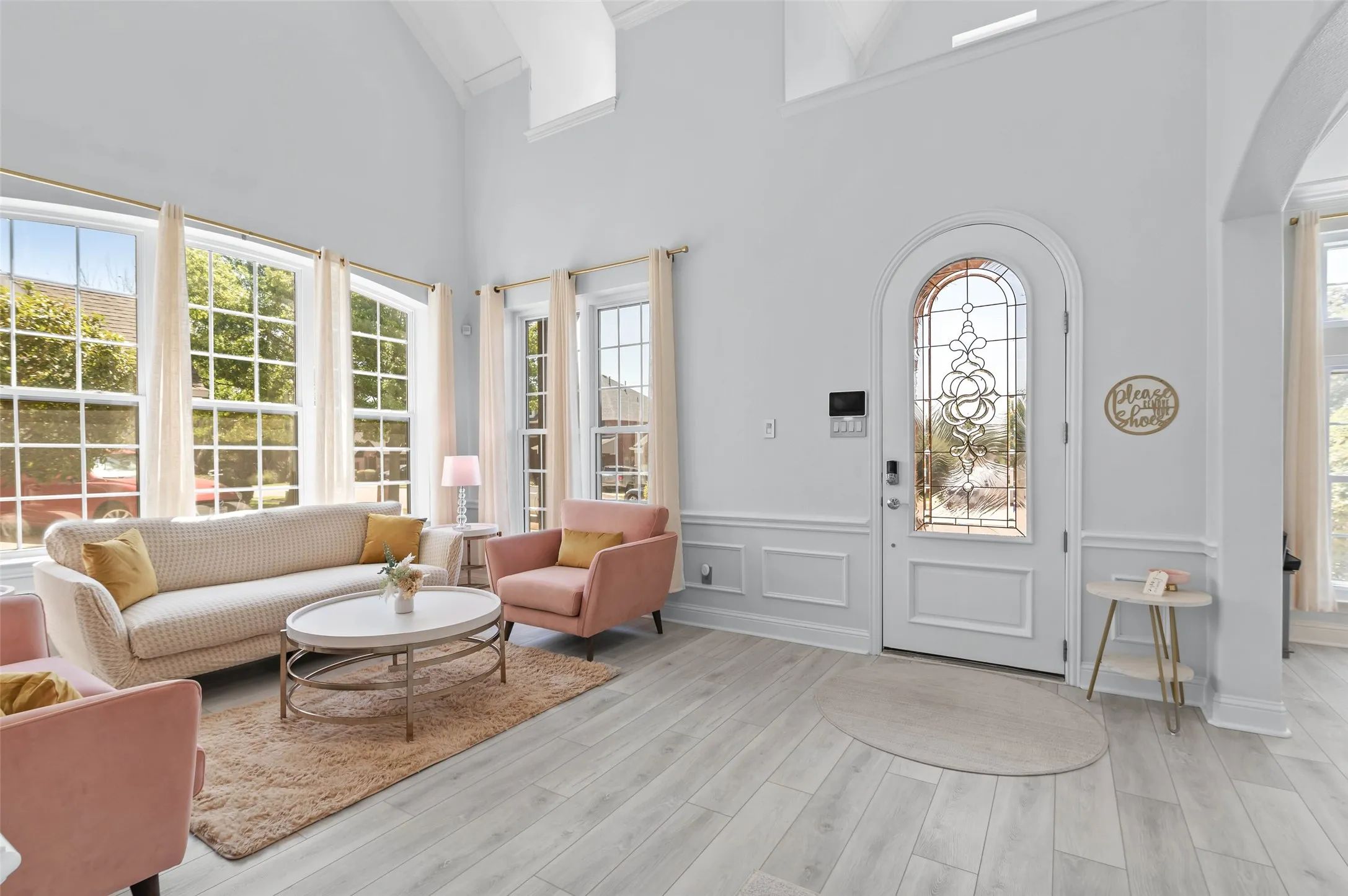 Beautiful leaded glass front door with sitting area off the entry and a study to the right.