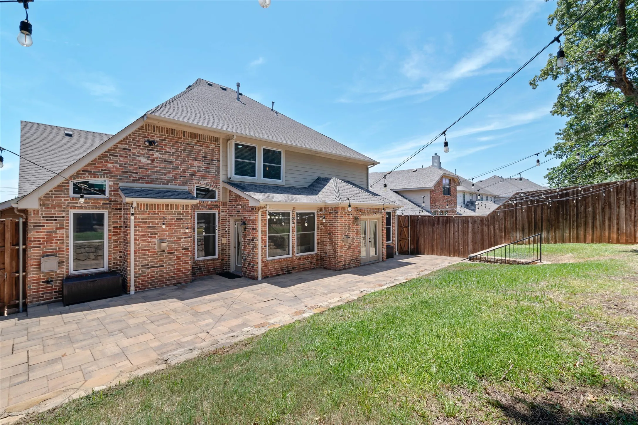 Large entertaining patio and raised yard