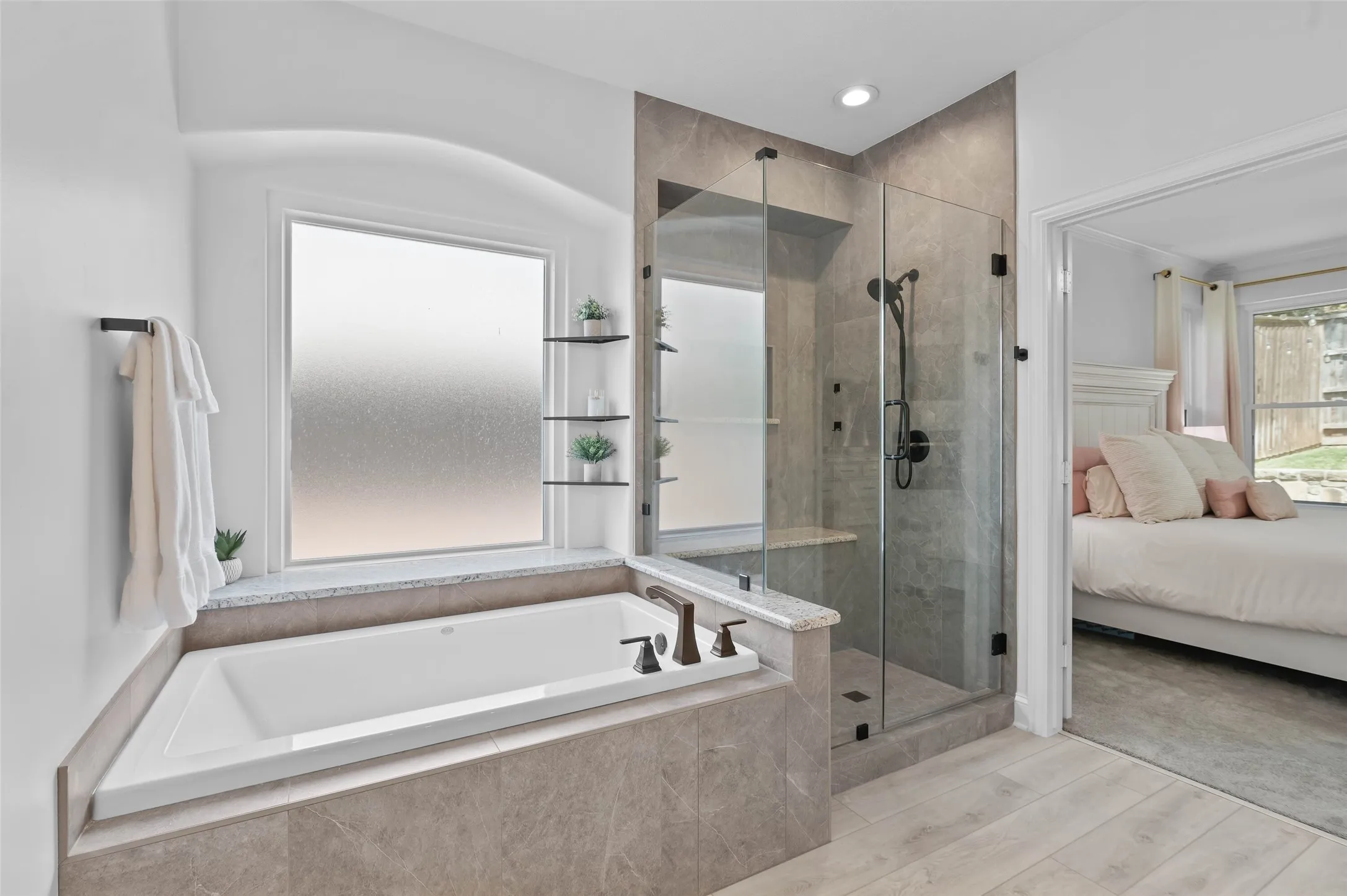 Enjoy your spa like retreat in the primary bath with separate shower featuring a seating bench and tub.