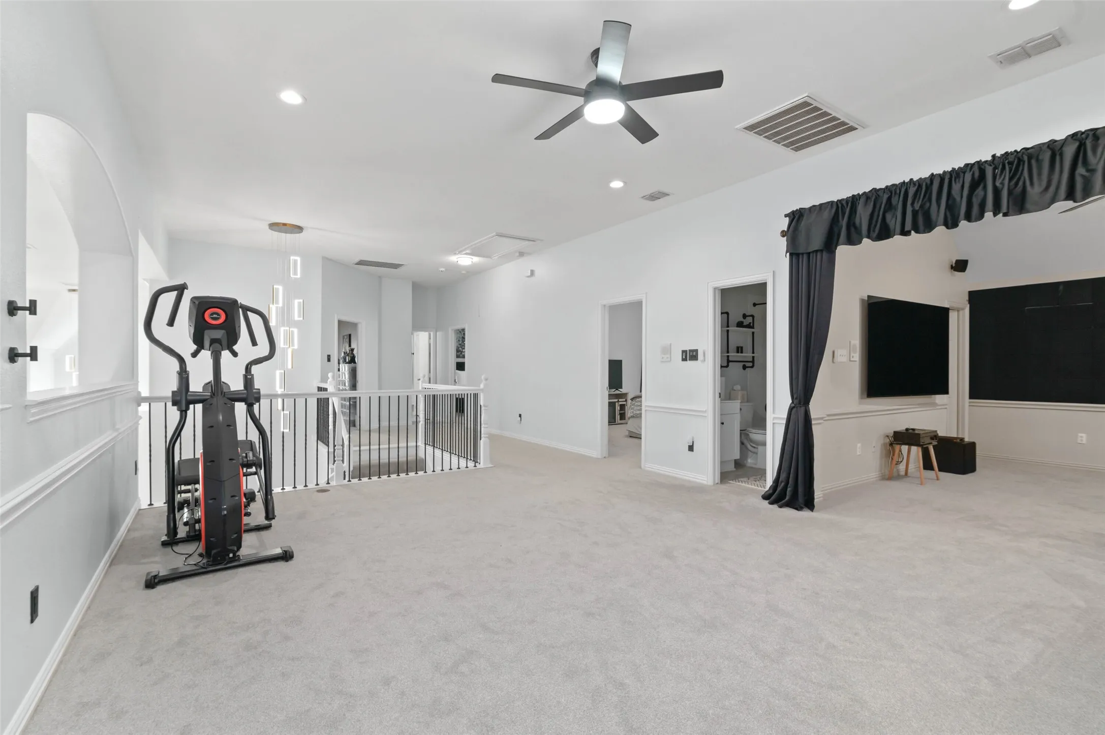 Large upstairs game room that pans to the media room