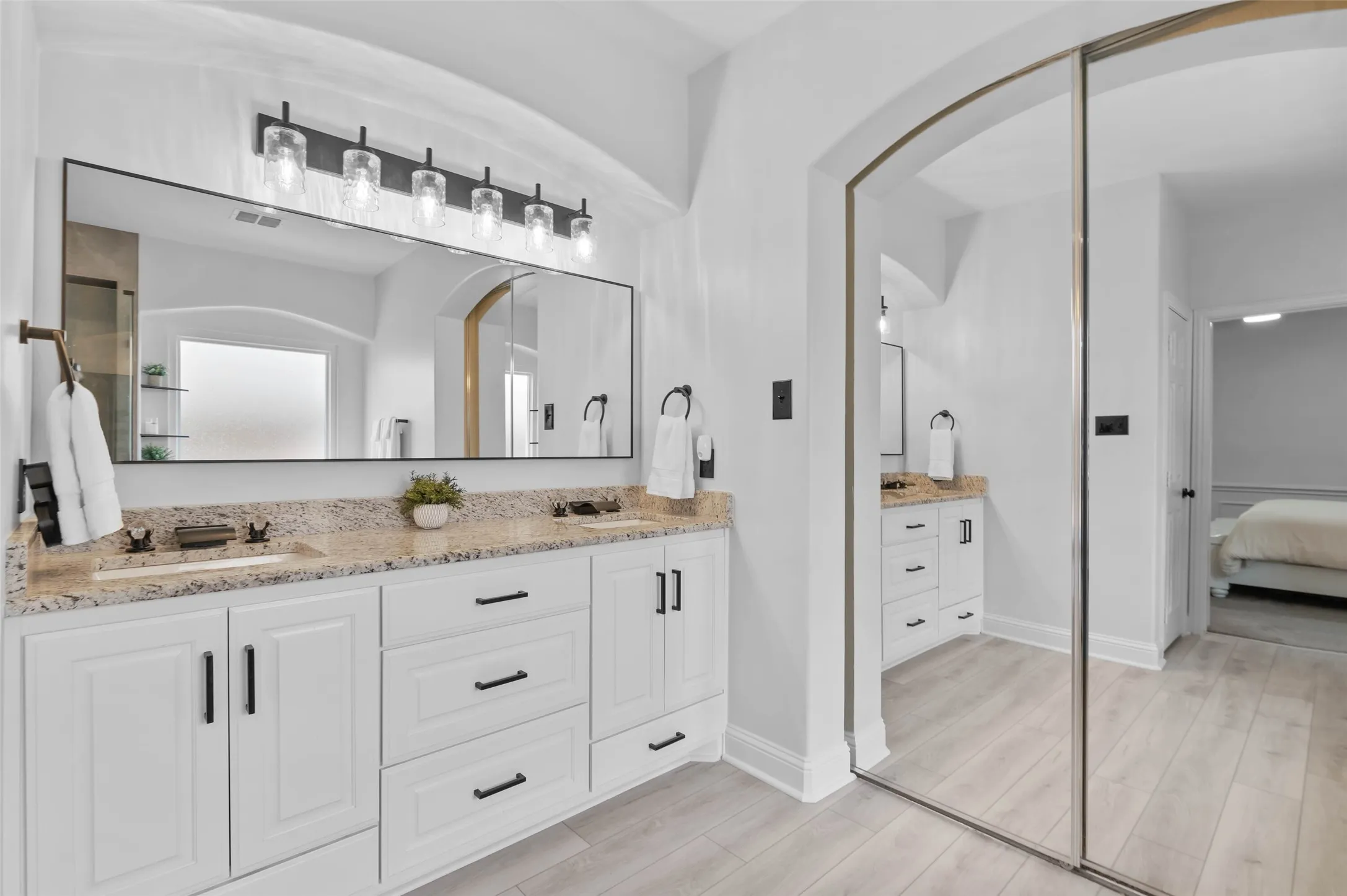 Double sinks with drawer and cabinet space in the vanity.
